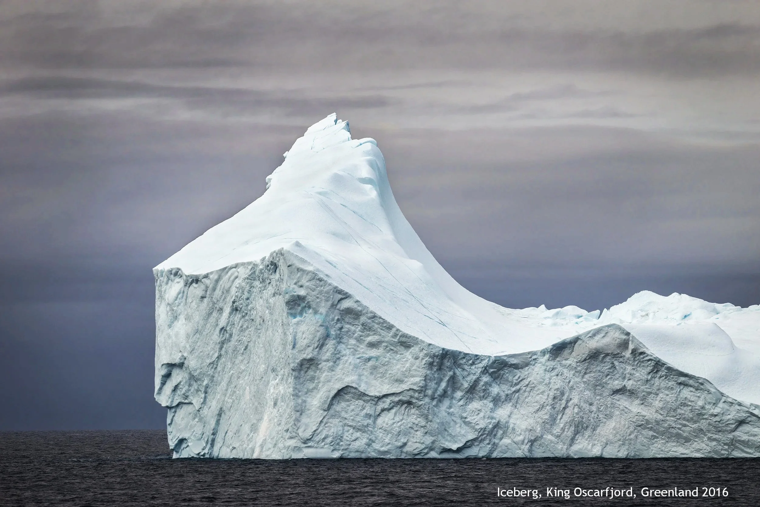 Grey Iceberg and Clouds, King Oscarfjord, Greenland 080616.jpg
