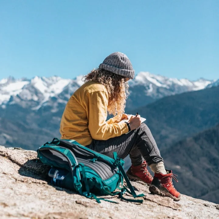 woman+with+anxiety+journaling+in+the+mountains.jpg