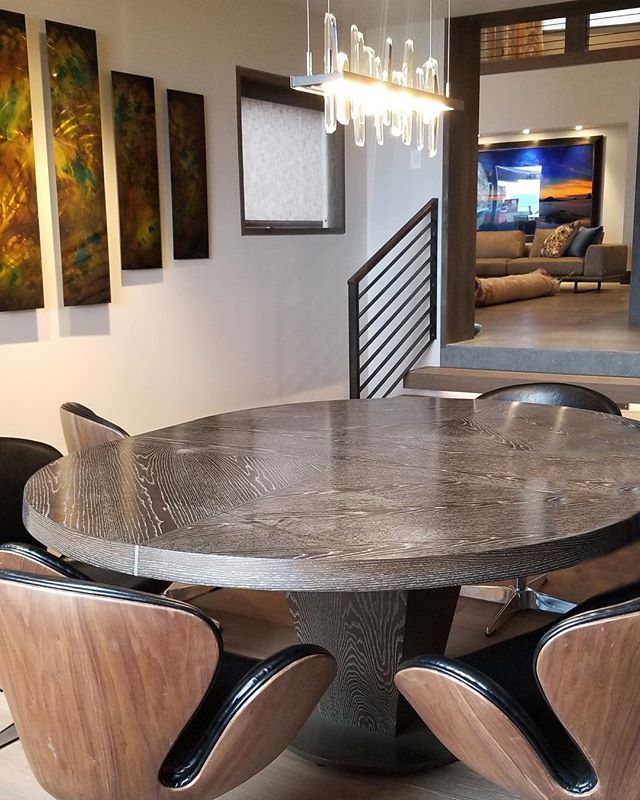 This custom, oval, wood veneer table designed by Solanna Custom Furniture sits just outside our Gym/Yoga Room at our Tahoe project, welcoming guests to sit and relax after a workout. #solannadesign