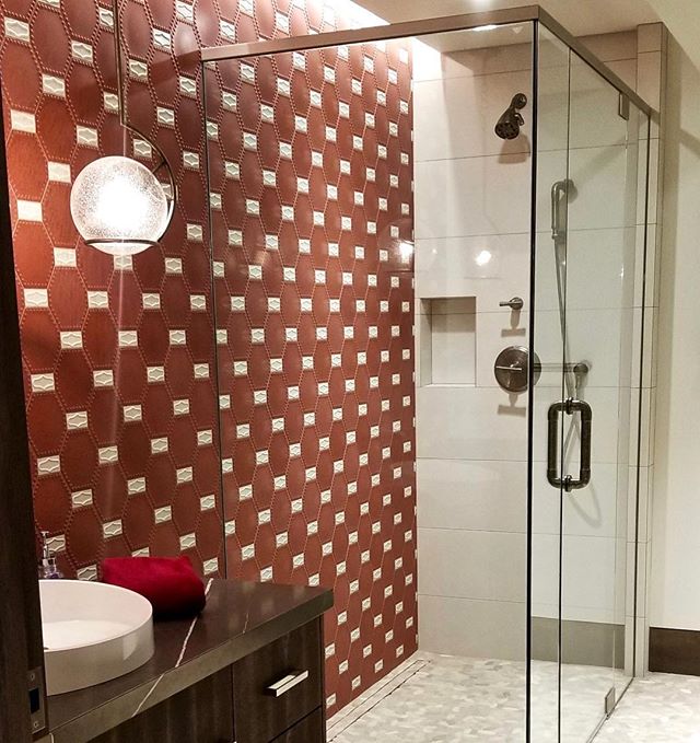 The kids bathroom gets a fun burst of red and white with @kazaconcrete tiles and @varaluz pendant that balances this art deco style with modern, clean curves. #solannadesign