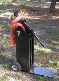 Pine Straw Box Baler which is usually made from wood or metal.