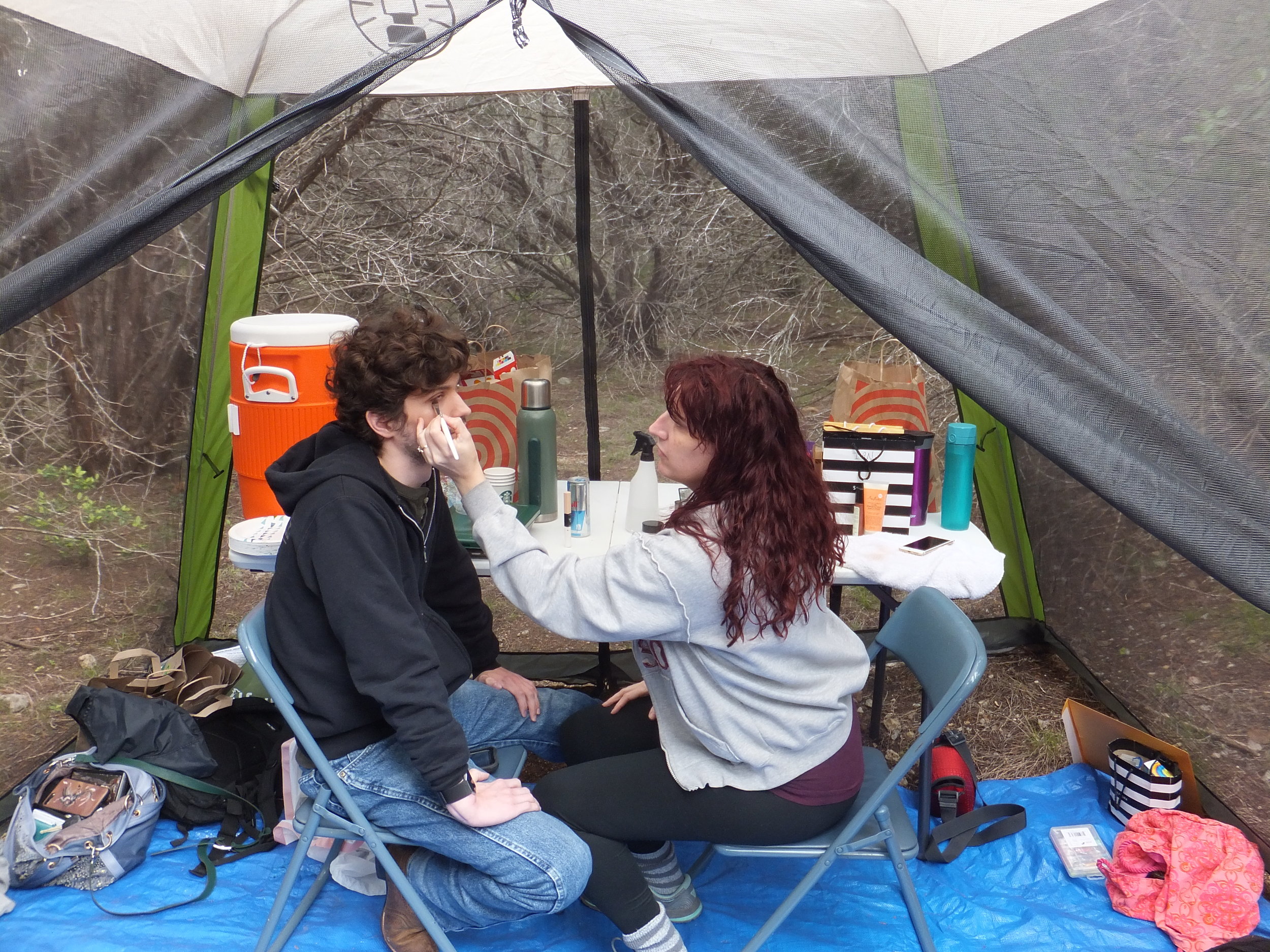 Meredith (right) doing makeup for actor Ian Loyd on the set of Garden of Jennat