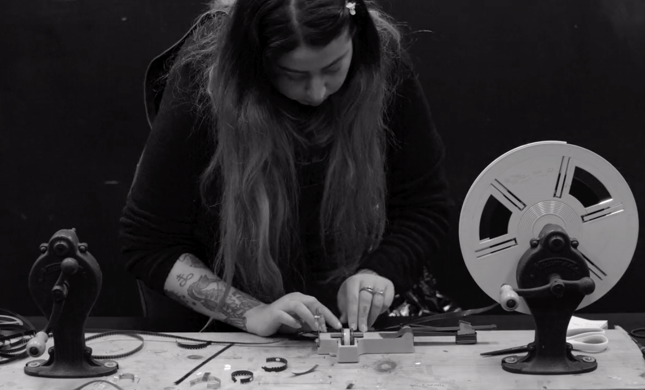 Faiza Kracheni splicing Super 8 raw film in our blackbox.