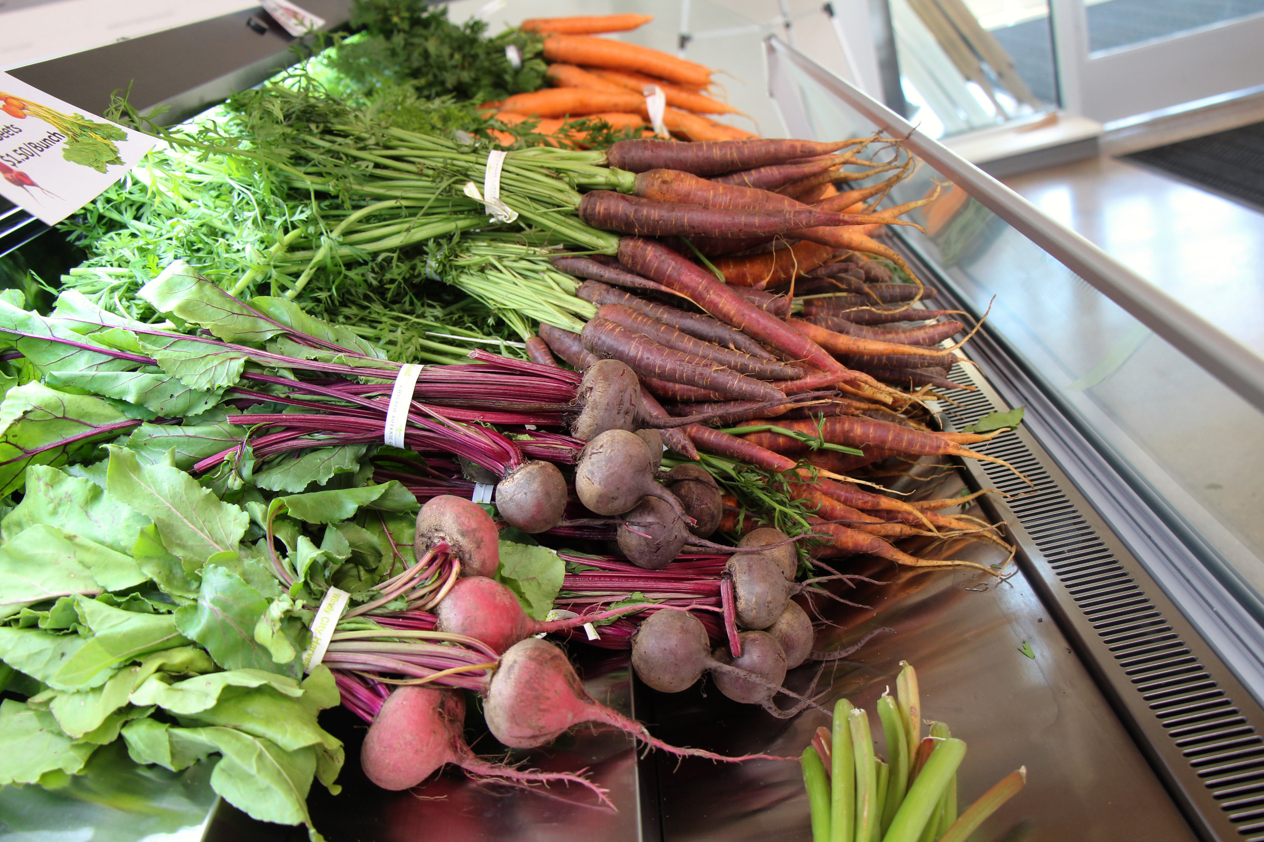  Bunches of carrots sell for $2 per bunch and beets sell for $1.50 per bunch.