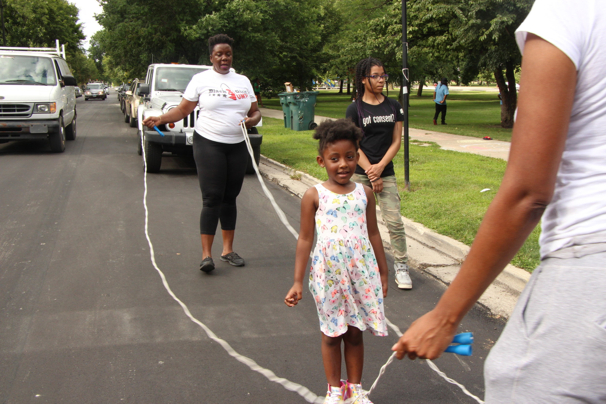  Volunteers jumping double dutch with attendees 