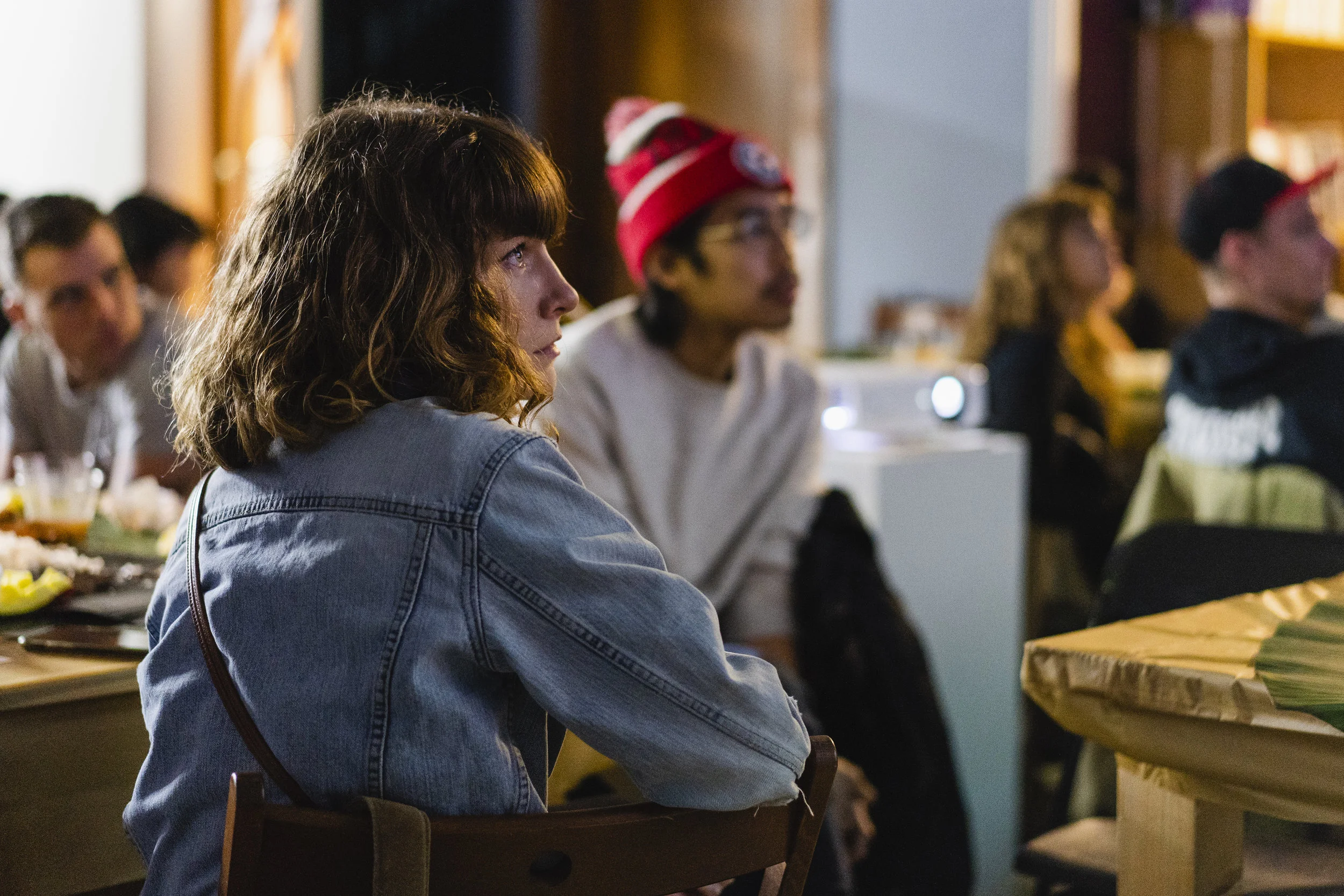 People watch the video, which explores the intersections of concepts like food, identity and authenticity.