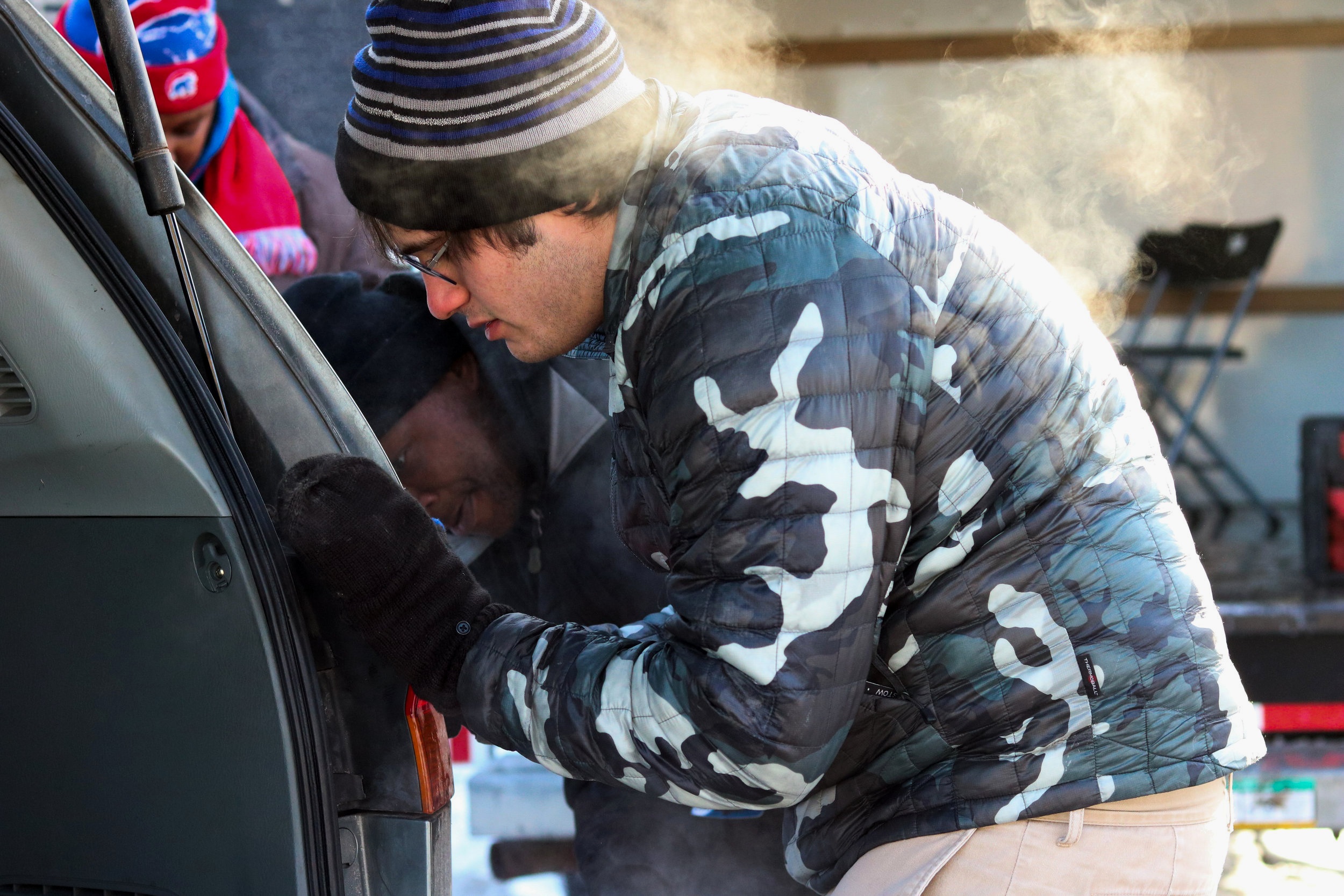  Volunteers helped community members make various repairs on their vehicles. 