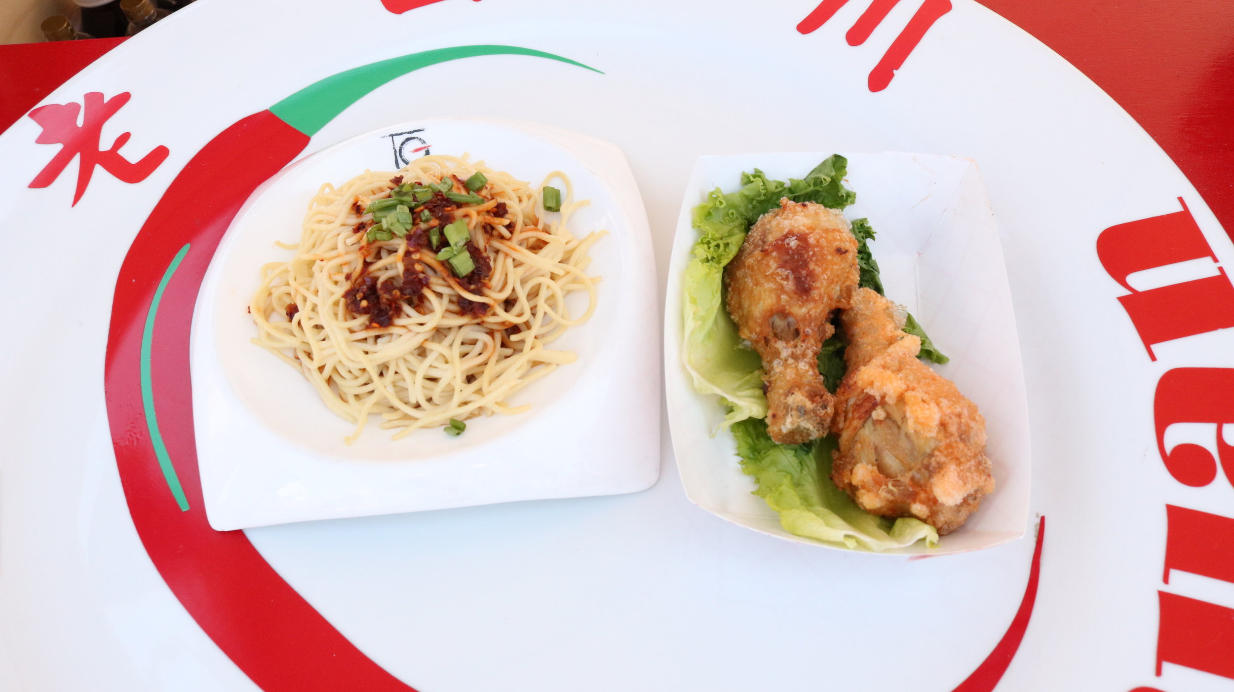  Lao Sze Chuan, one of the Asian restaurants at the Taste of Chicago, displays Cold Noodle Salad and Szechuan Style Chicken. Photo by Clariza Adao      