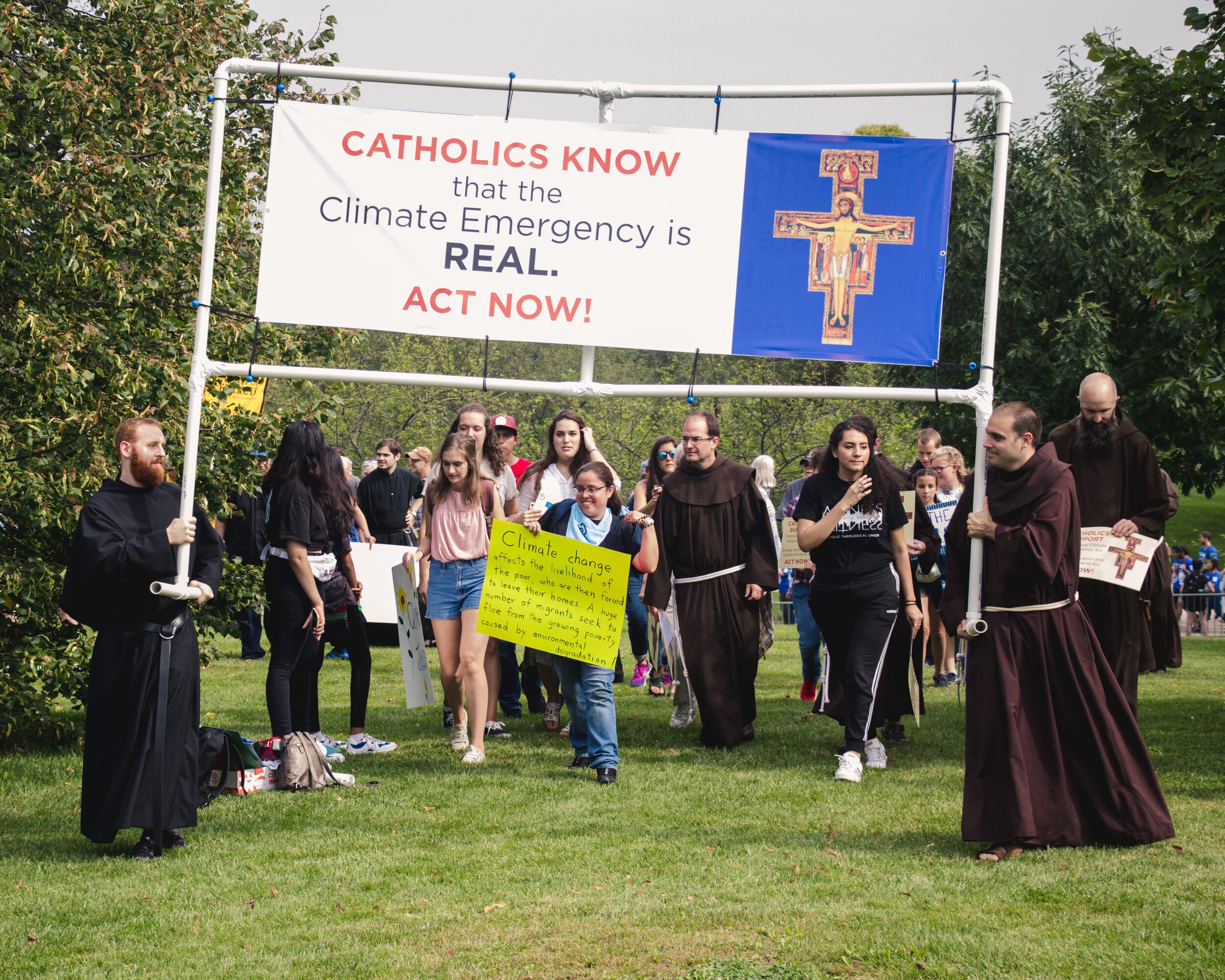 A Catholic group moves with members of their congregation to reserve a spot near the front of the march.