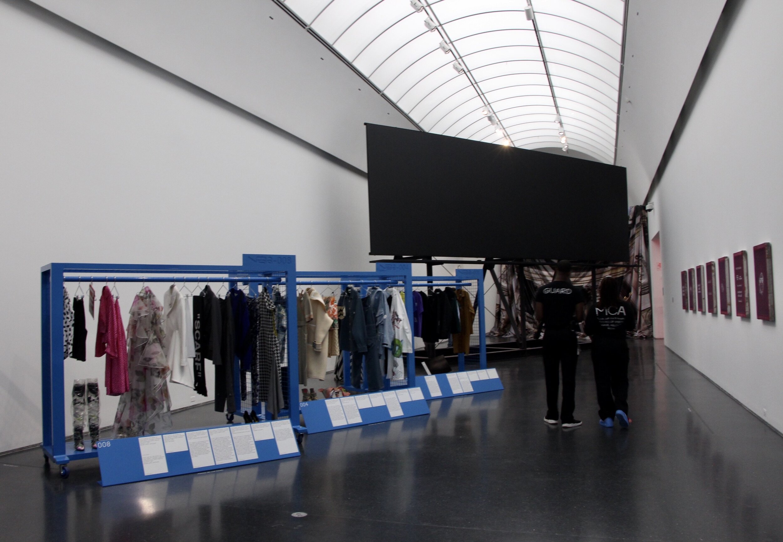 Inside Chicago’s Museum of Contemporary Art, seven rooms helped showcase Virgil Abloh’s ‘Figures of Speech’ exhibit. At the end of one room, azure blue racks with ‘Off-White’ and Louis Vuitton garments and an all-black billboard were on display. 
