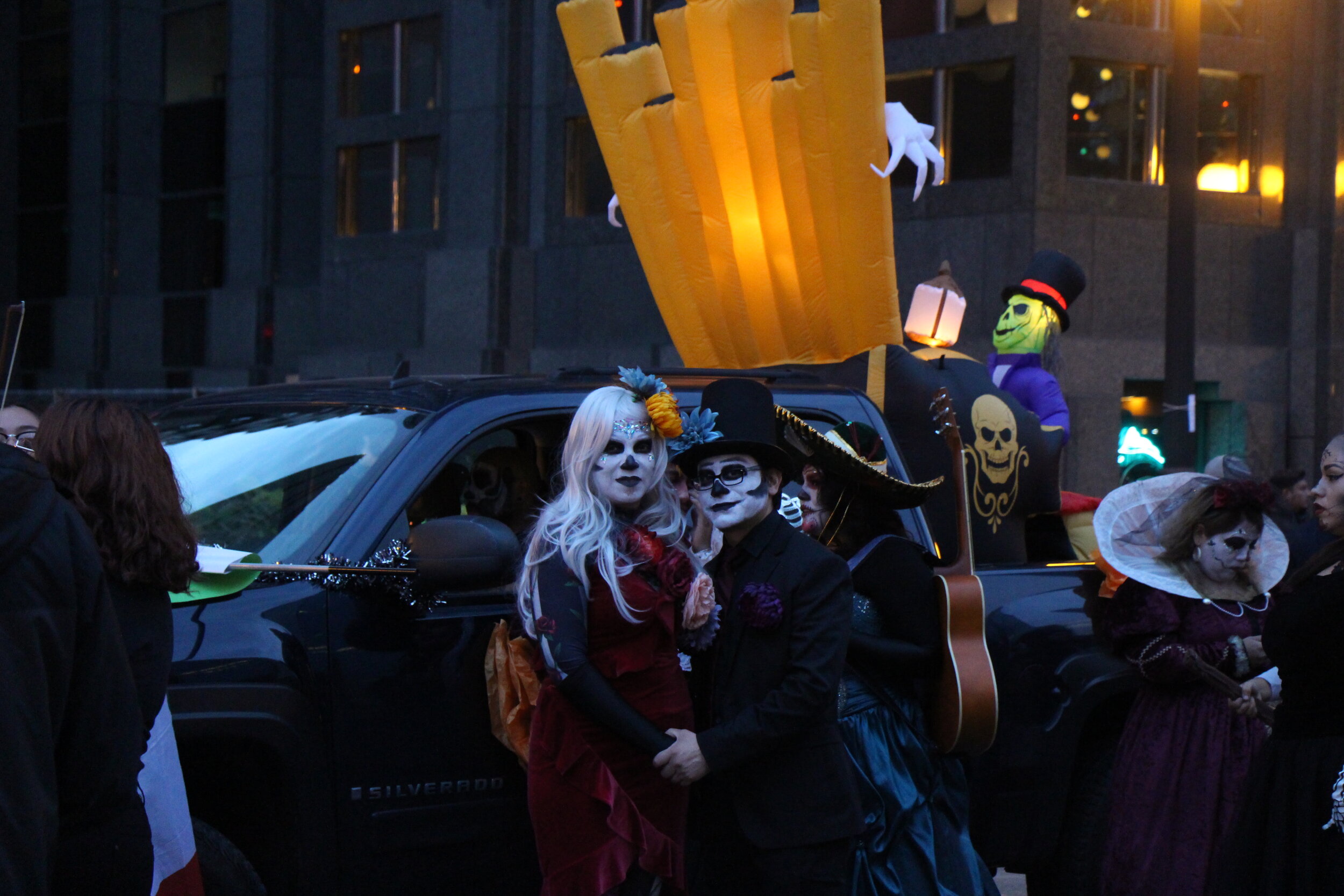 A couple pose during the parade while showing off their costumes