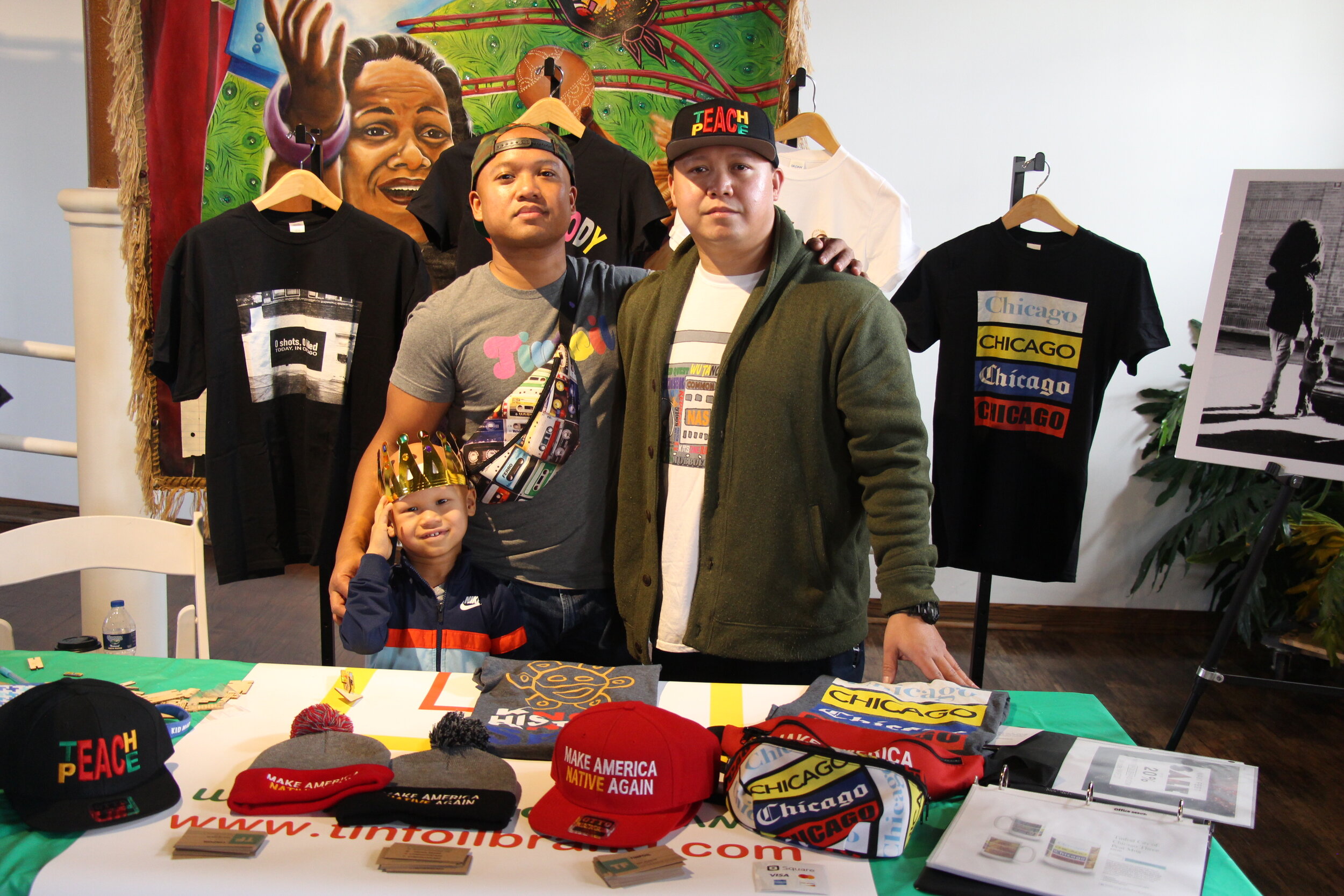  Founder of Tinfoil, Michael Velasquez (right), brother and nephew(left), showcases his 10-year old clothing brand that specializes in conspiracy, political, and inspirational apparel. 