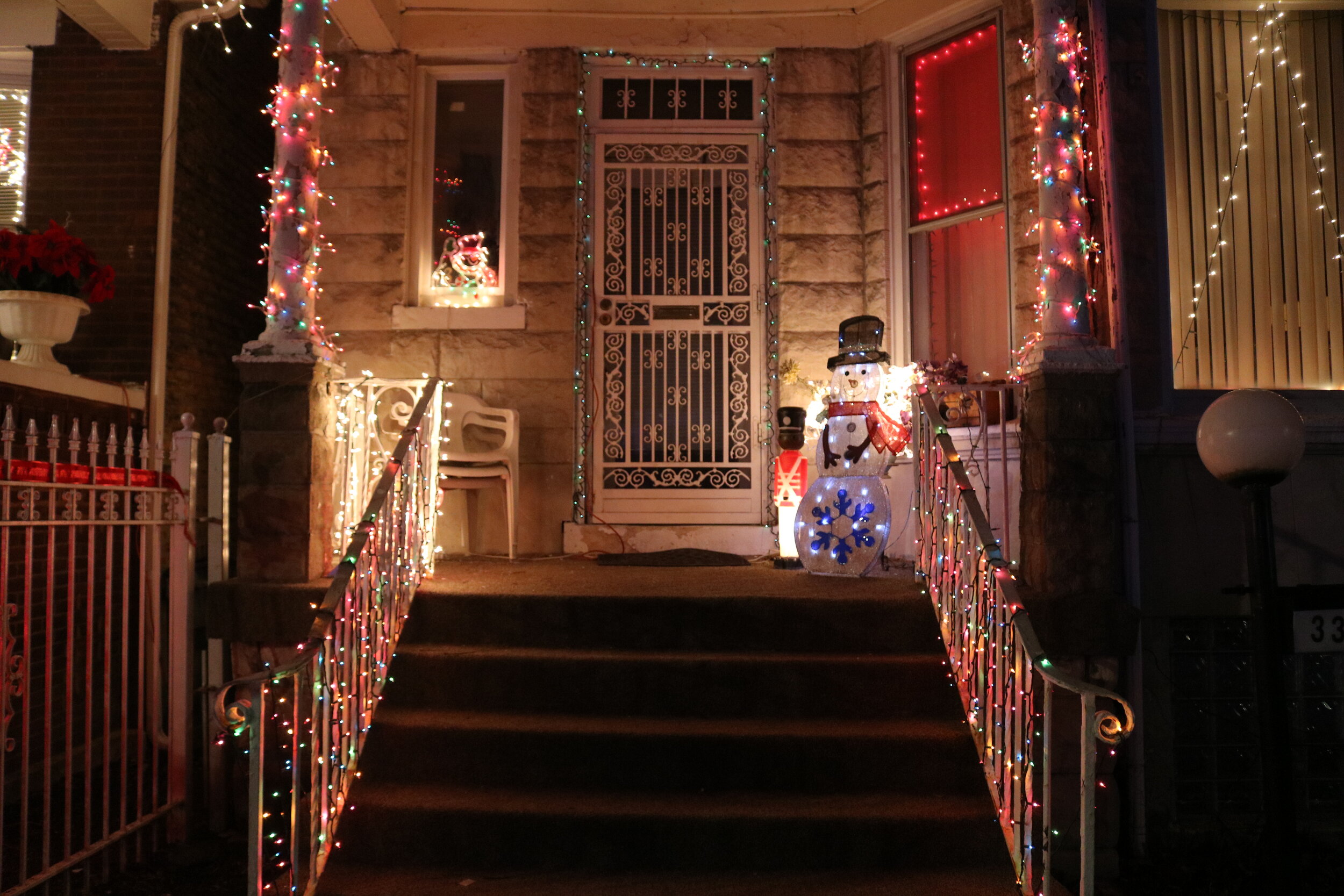  Christmas lights shine on a home at in the 3300 W Flournoy block during the Block Club Christmas Lighting event. 