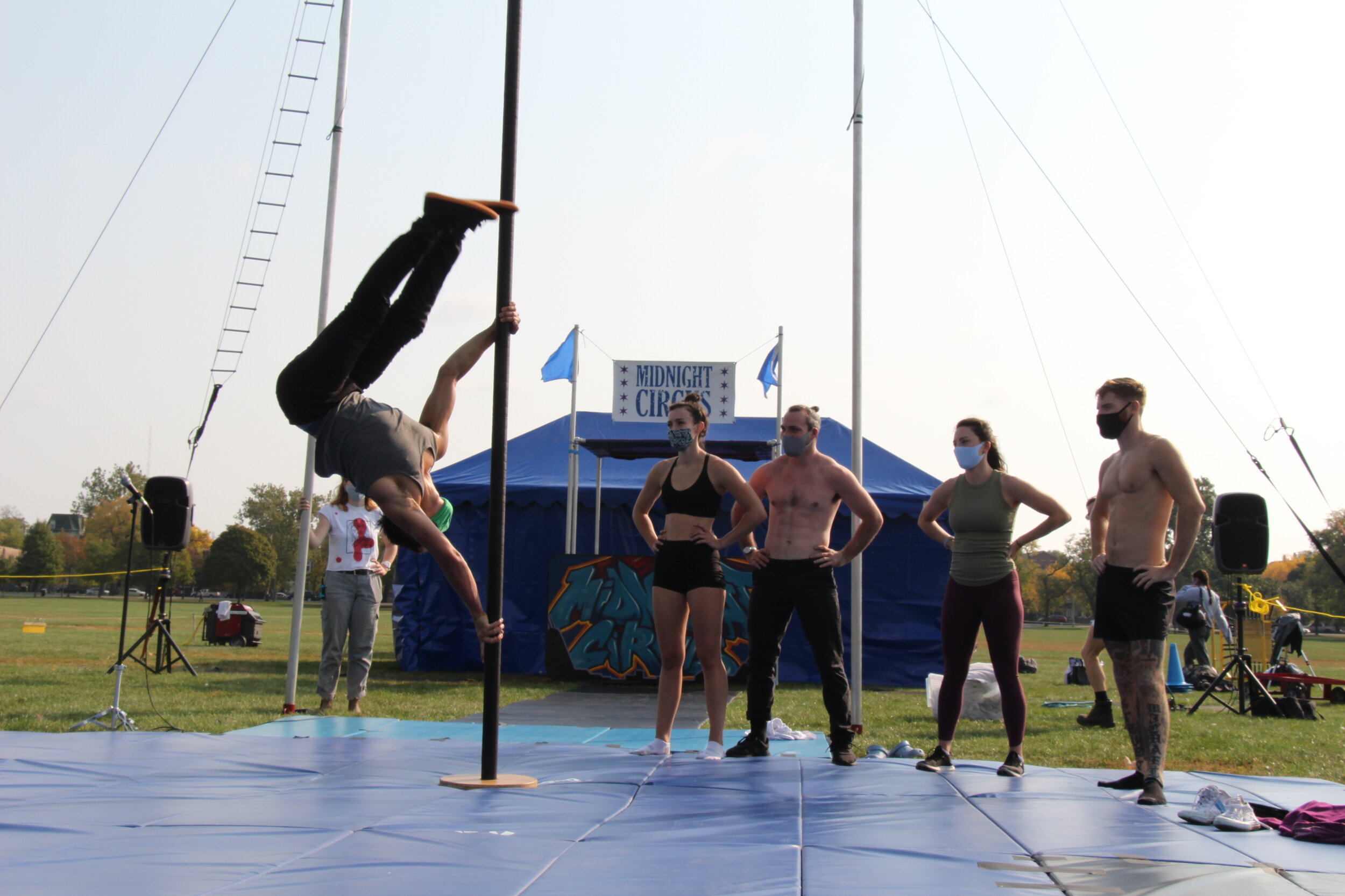  After setting the stage up, acrobats are seen practicing for their performances. (Photo taken by Sabrina Hart)    