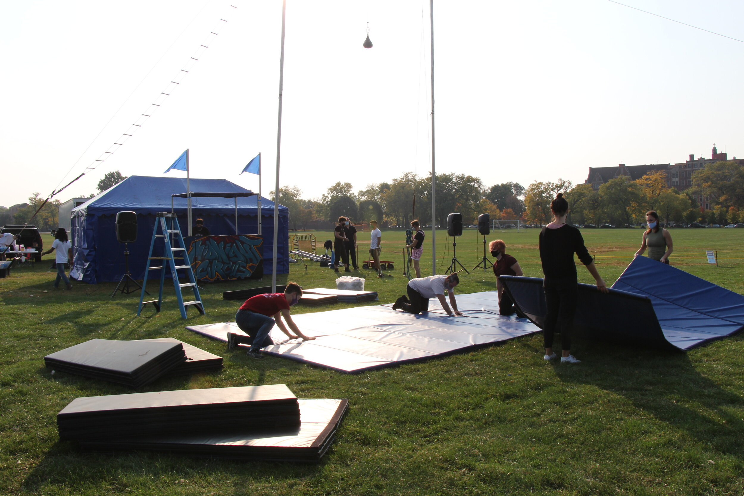  On the morning of the open-air show volunteers and acrobats set up the stage at Park No. 218. (Photo taken by Sabrina Hart) 