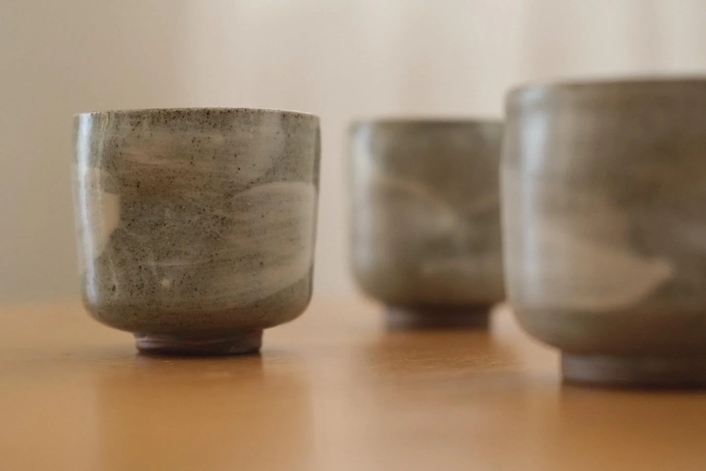 A new coffee cup form - dark stoneware with thick white slip brush strokes and clear glaze. Available at my studio sale this weekend.