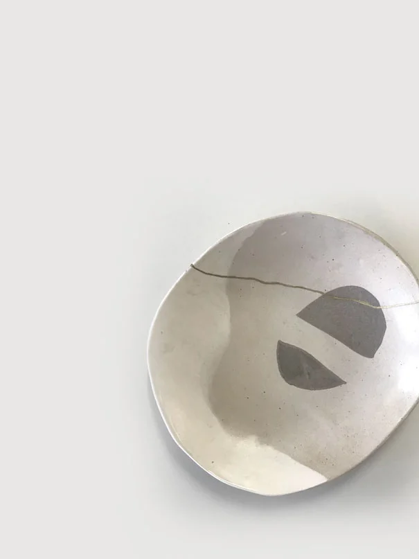 Crescent Plate / $75 – SOLD White, recycled & black clay with matt white glaze and bronze kintsugi detail