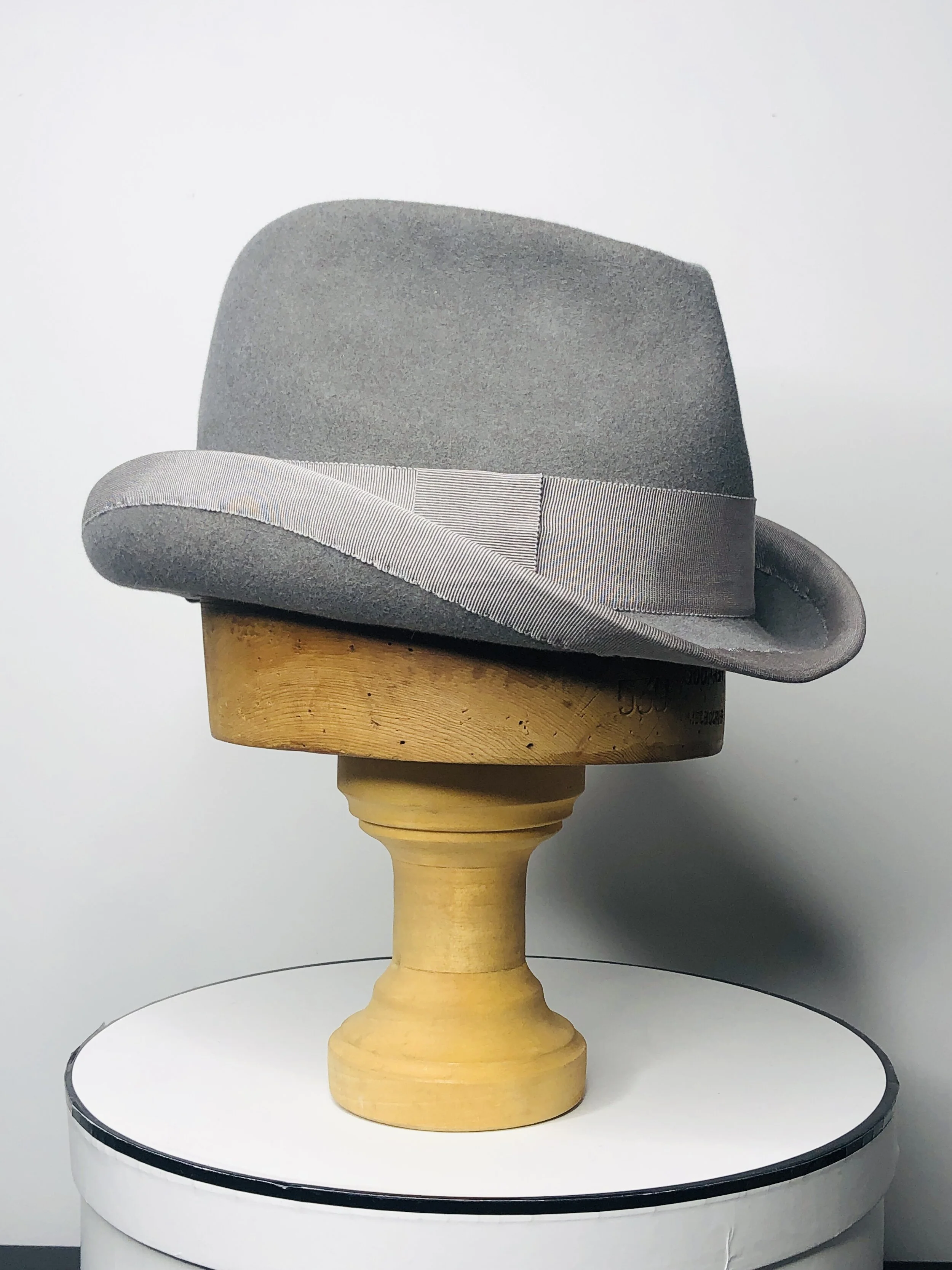 looking stylish in a hand had felt hat