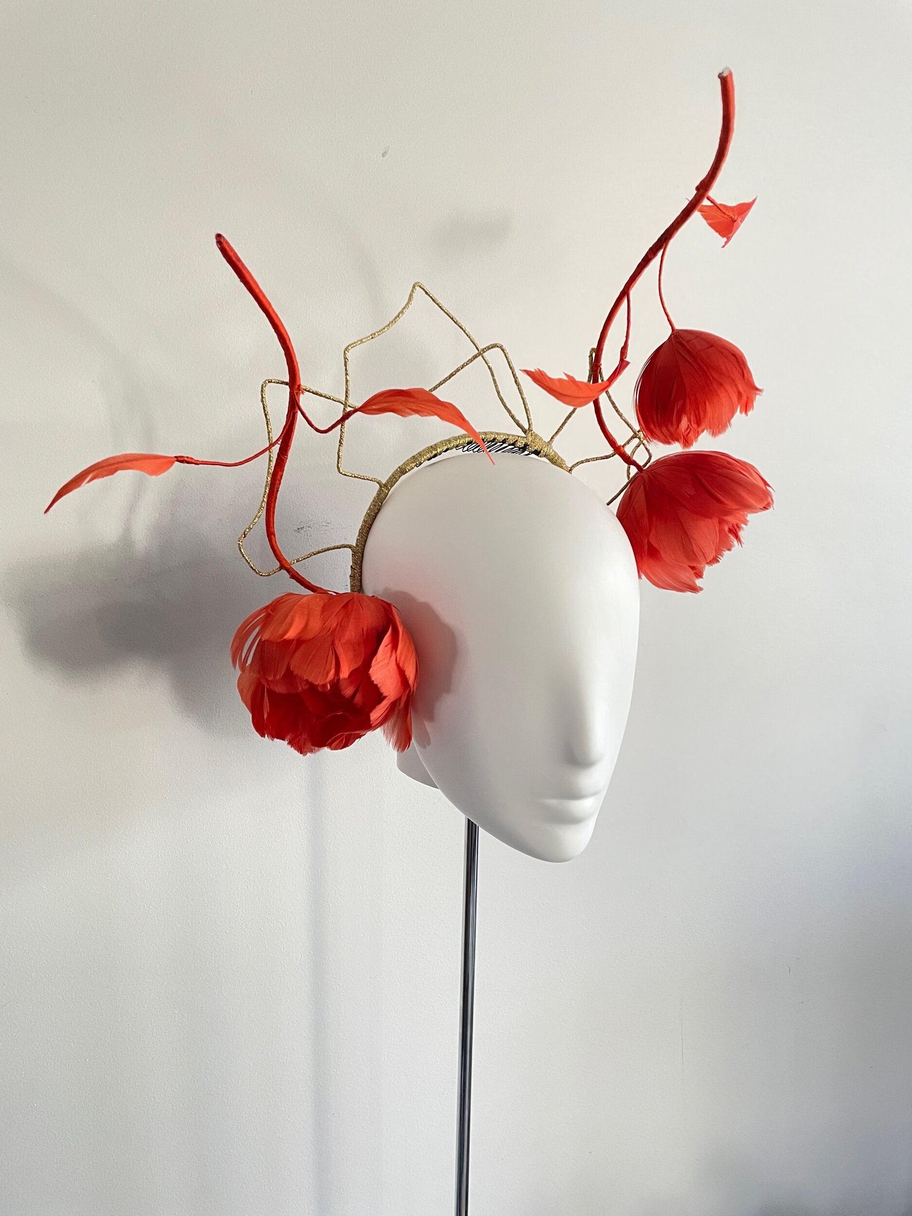 rambling feather roses balancing on  a headband