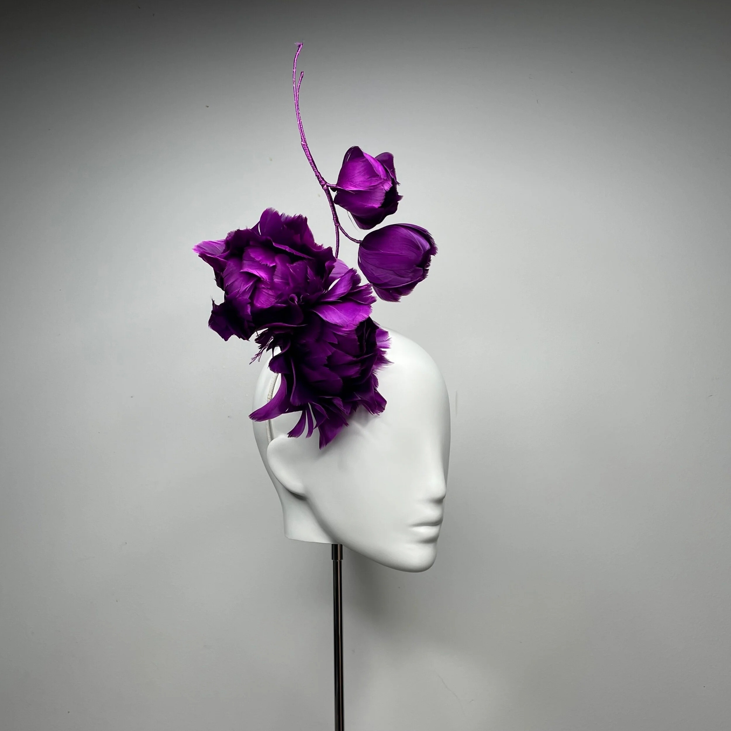 fashion hat made from deep purple feathers