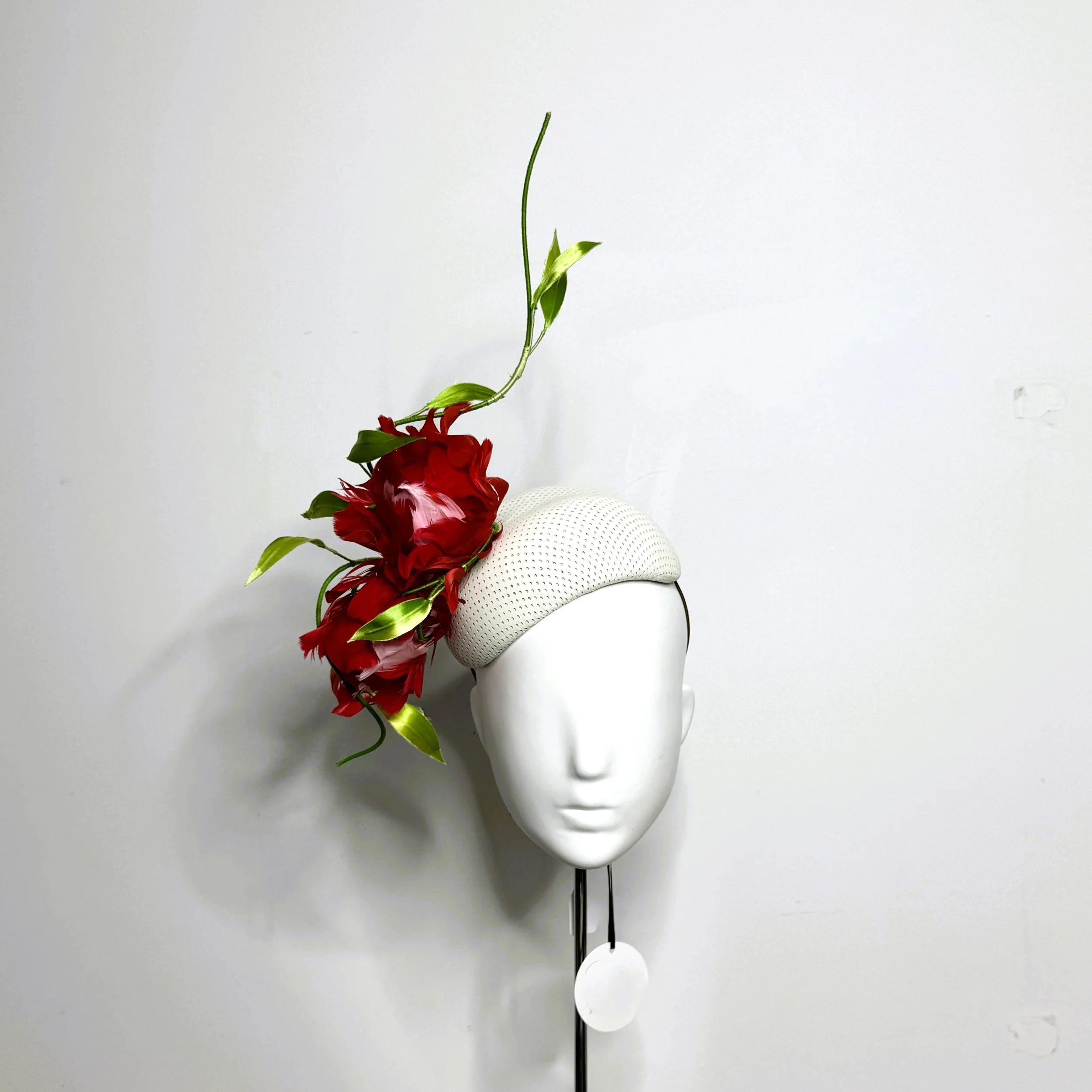 Leather and feather hat by Rachel Henry Millinery