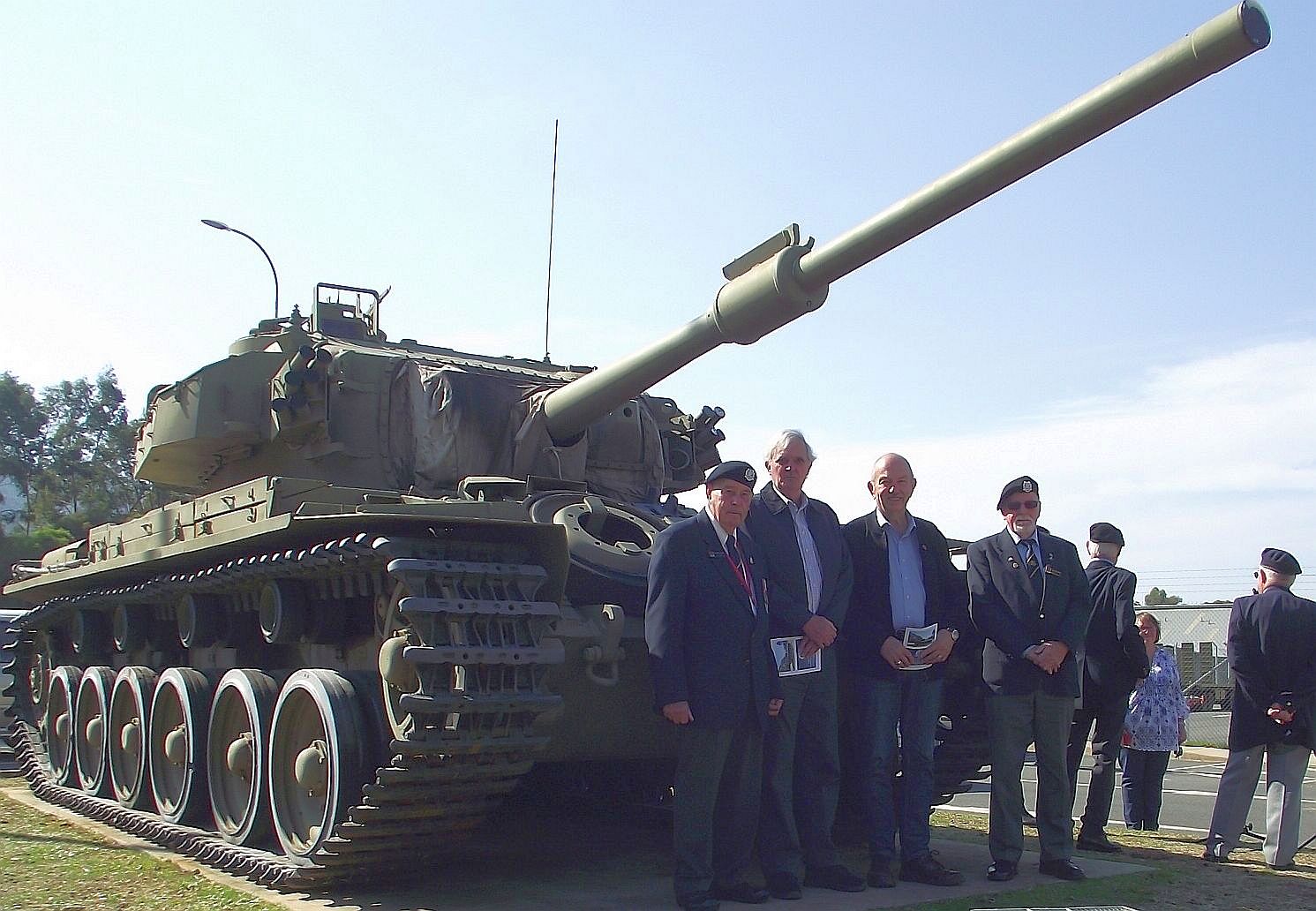 Members of the Association standing in front of the Memorial Tank following the Service.
