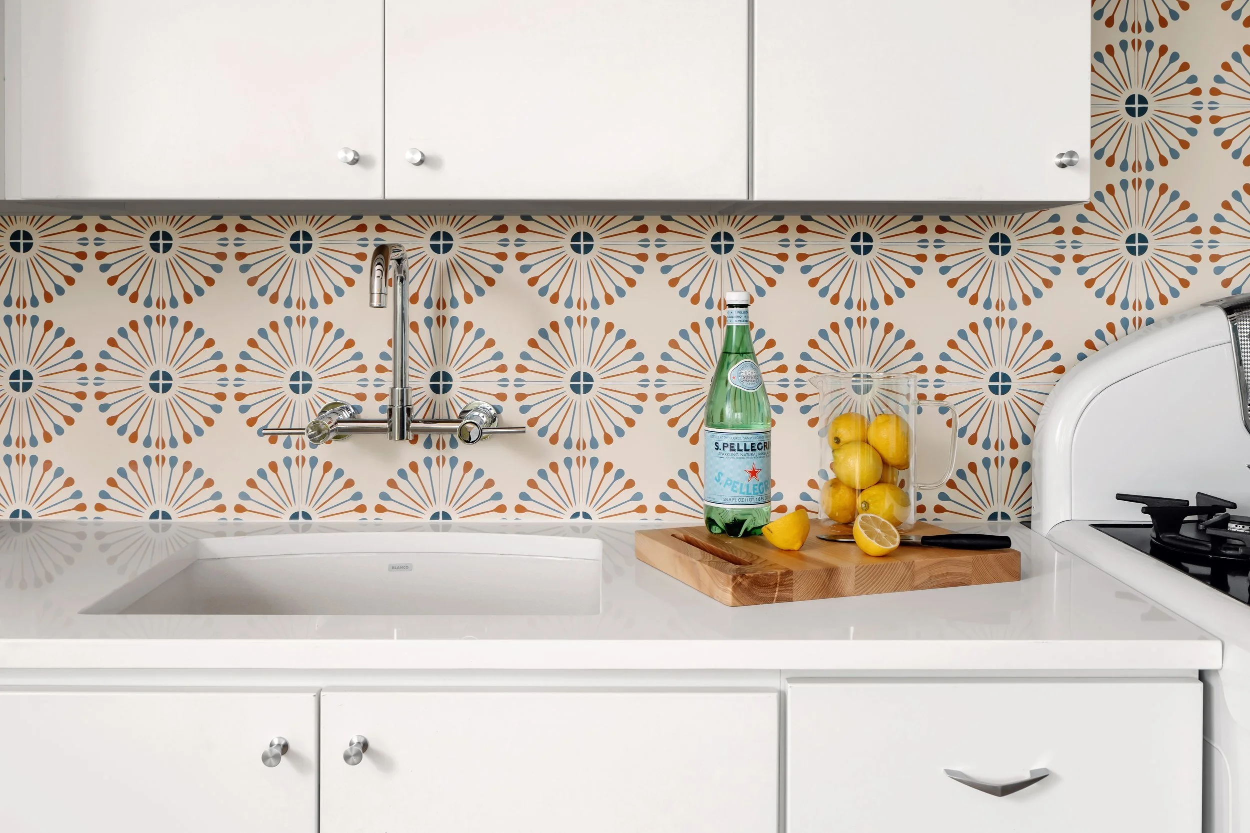 ADU kitchen with patterned cement tile backsplash, Breathe Design Studio
