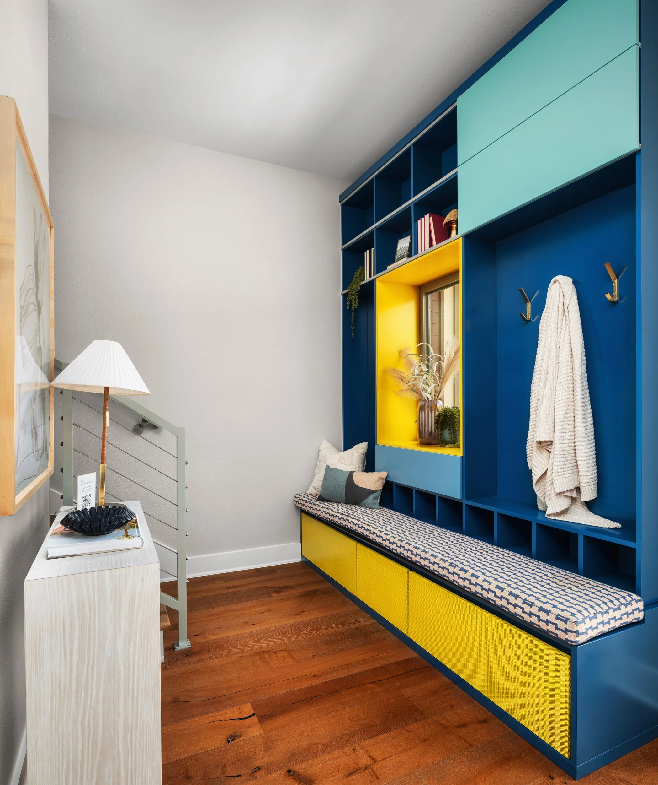 Custom blue and yellow entry bench with built in storage, Breathe Design Studio