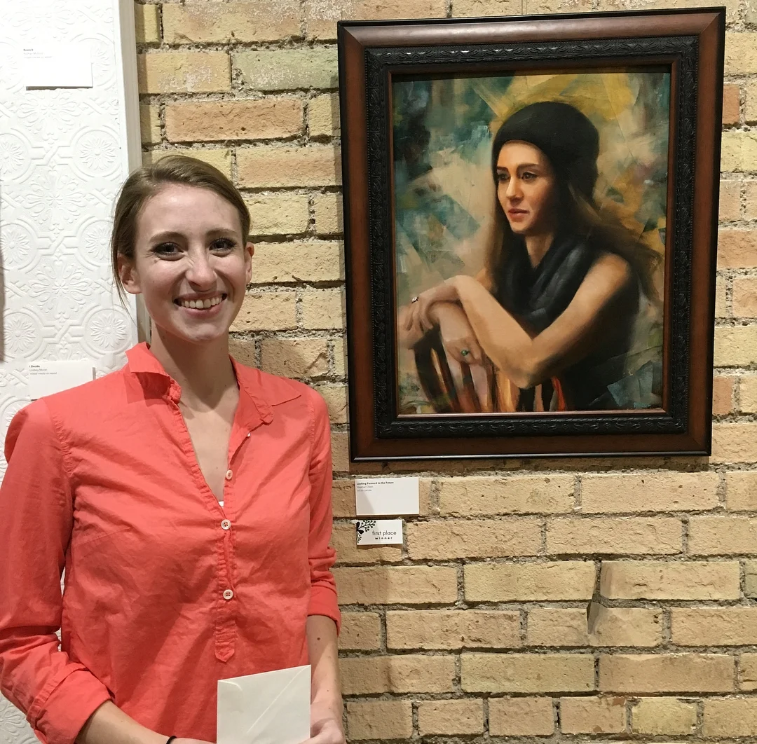 Heather Olsen, 1st place winner of "Coppice: An Art Exhibition," is pictured with her winning painting titled "Looking Forward to the Future." 