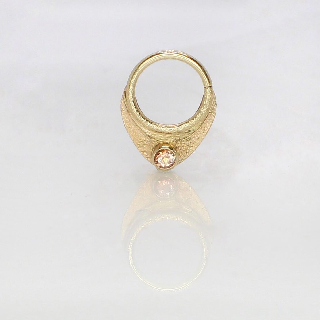 We have some big news coming&hellip;stay tuned! And in the meantime you&rsquo;ll want to start planing your next piercing project (trust us). Maybe with this handmade, one of a kind shield with peach topaz, perfect for a septum.
.
.
#handmadejewelry
