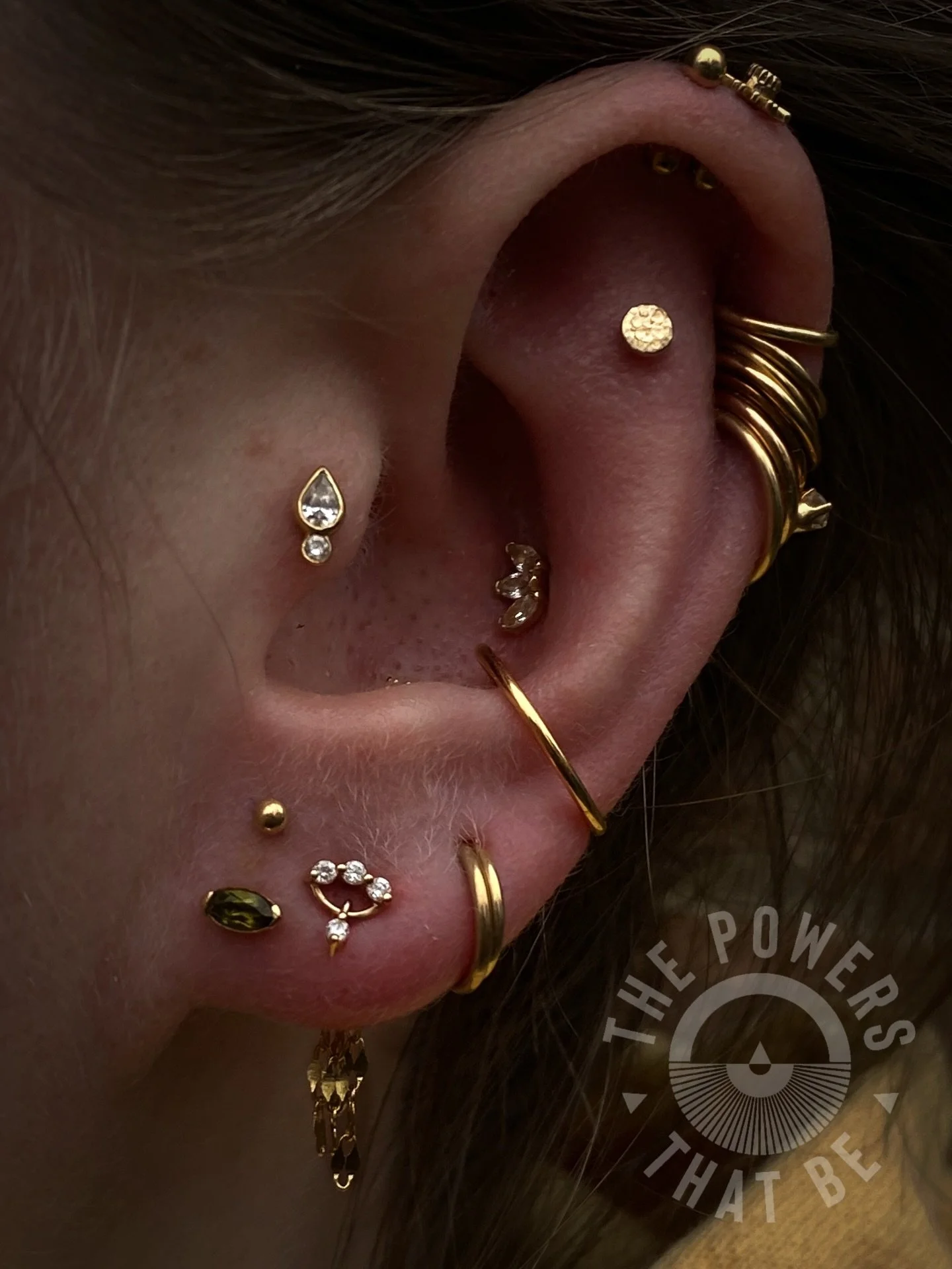 Fun lobe placements are FUN✨

Lindsay stopped by to get some new things pierced and new jewelry installed and wow 🤩 we are swooning over how this turned out!🥹

Two new stacked lobes with a yellow gold ball and a green yellow gold marquise end✨
We a