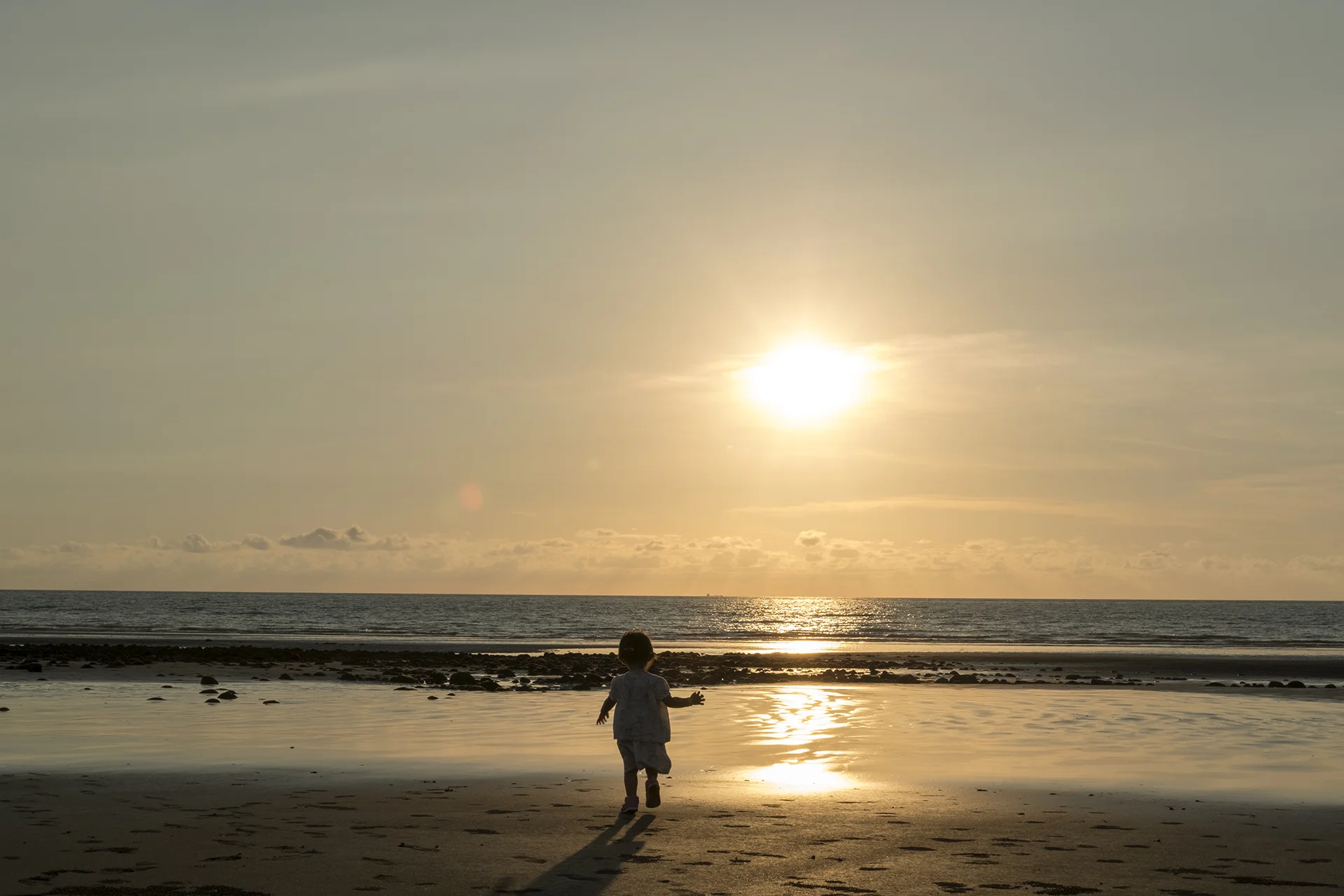 My daughter runs toward to the sea, Taoyuan, Taiwan