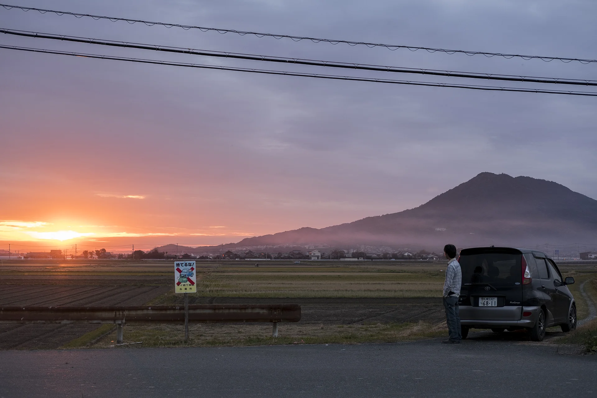 Kentaro Oka and Mt. Kaya (Kayasan) in the sunset, Itoshima, Japan