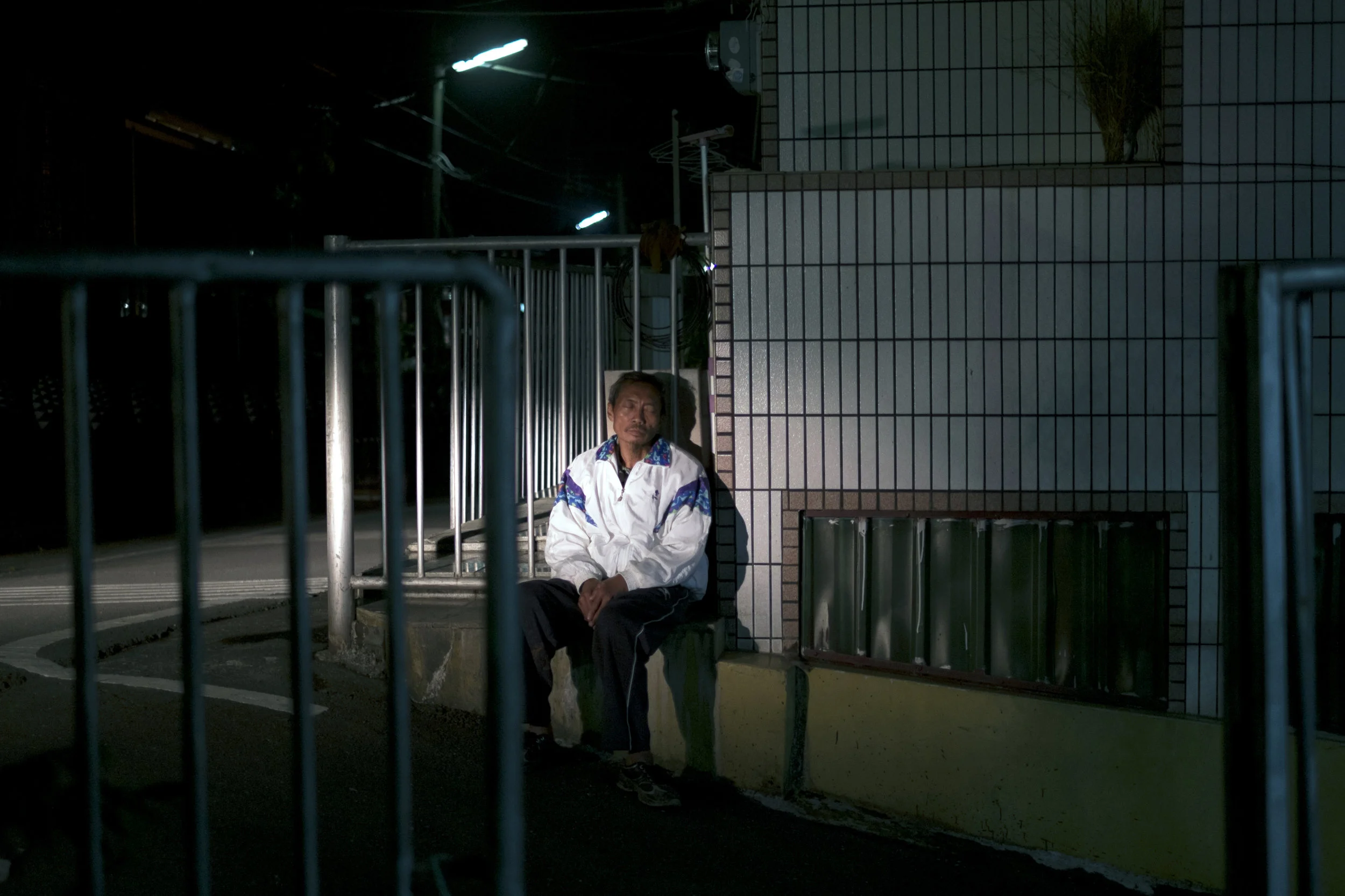 A blind aboriginal was illuminated by the headlights, Laiyi, Pingtung, Taiwan
