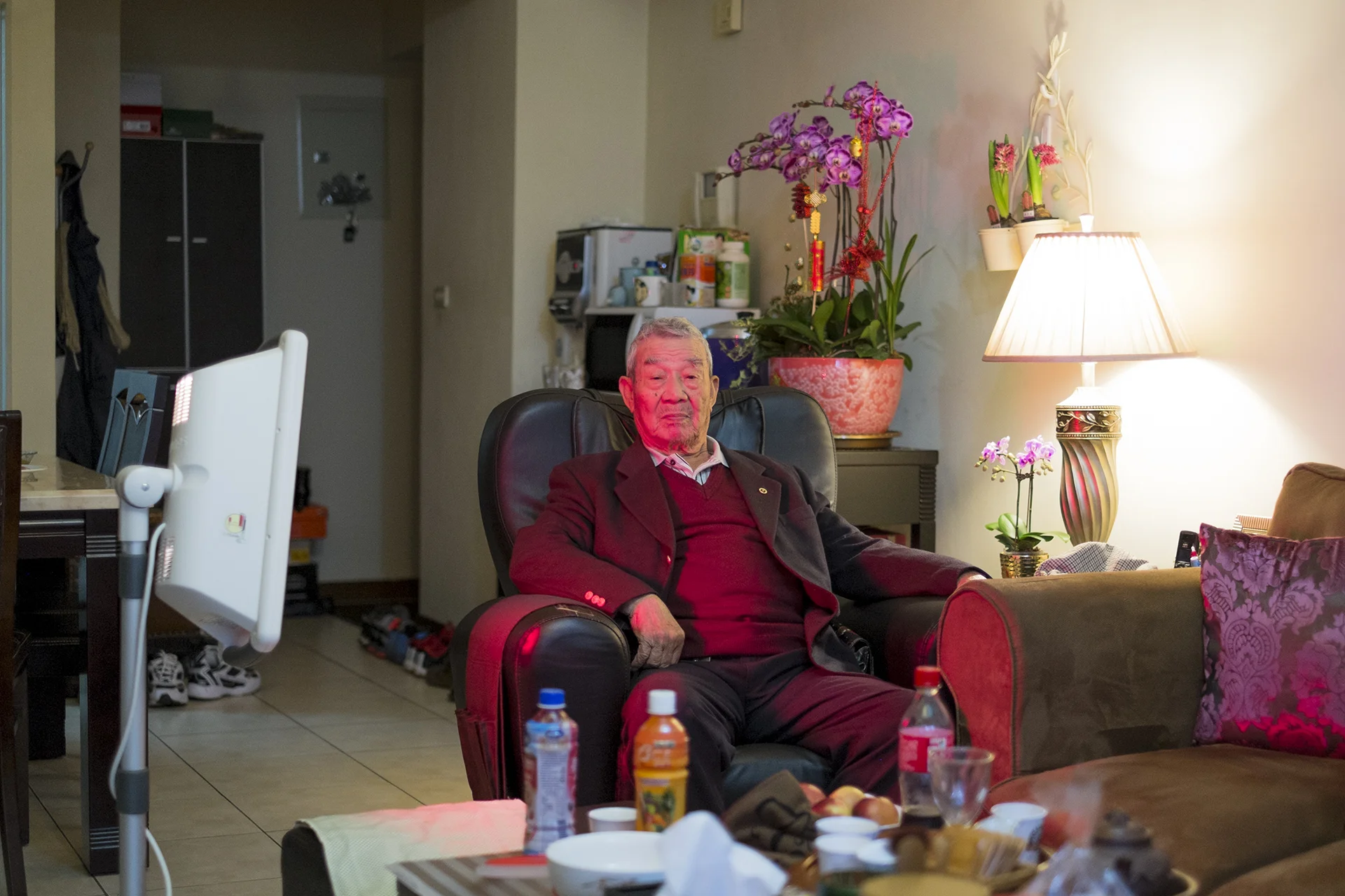 My grandfather curing himself by a far Infracare infrared lamp, Yangmei, Taoyuan, Taiwan