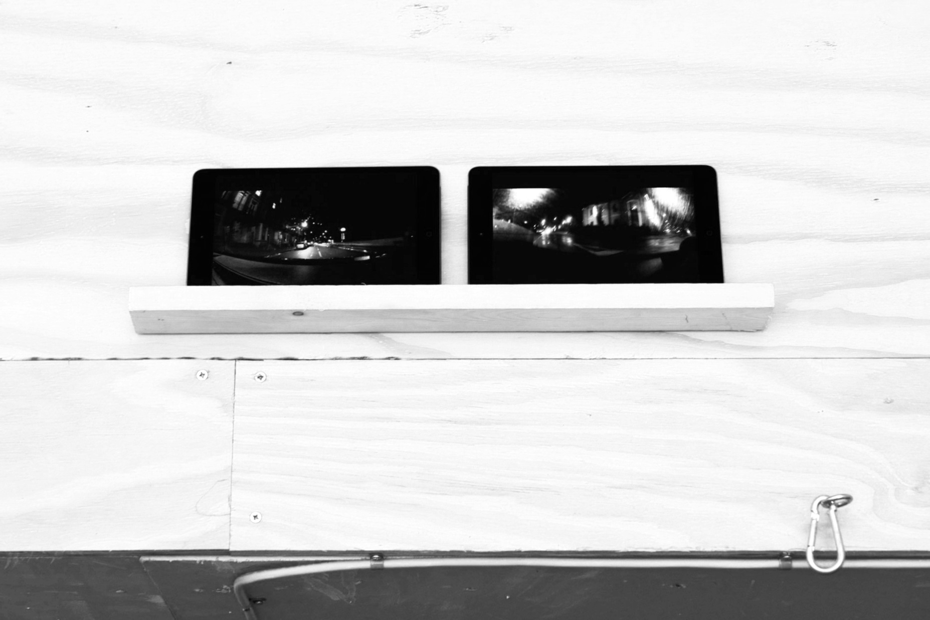 Streets is Watching , 2018 2 x single channel silent videos, 2 x iPad mini2 Wi-Fi, wooden shelf