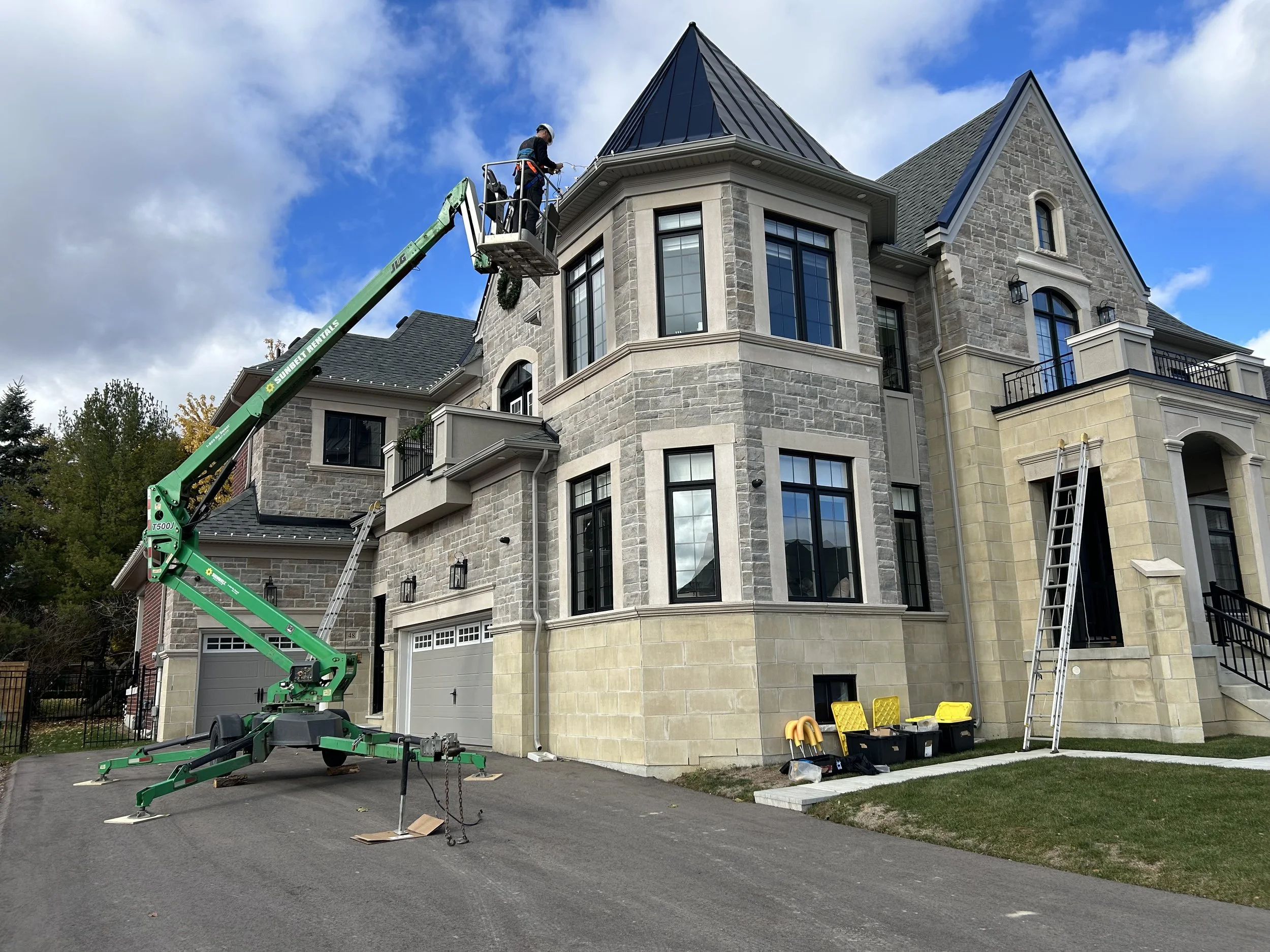 Christmas Light Installation with boom lift