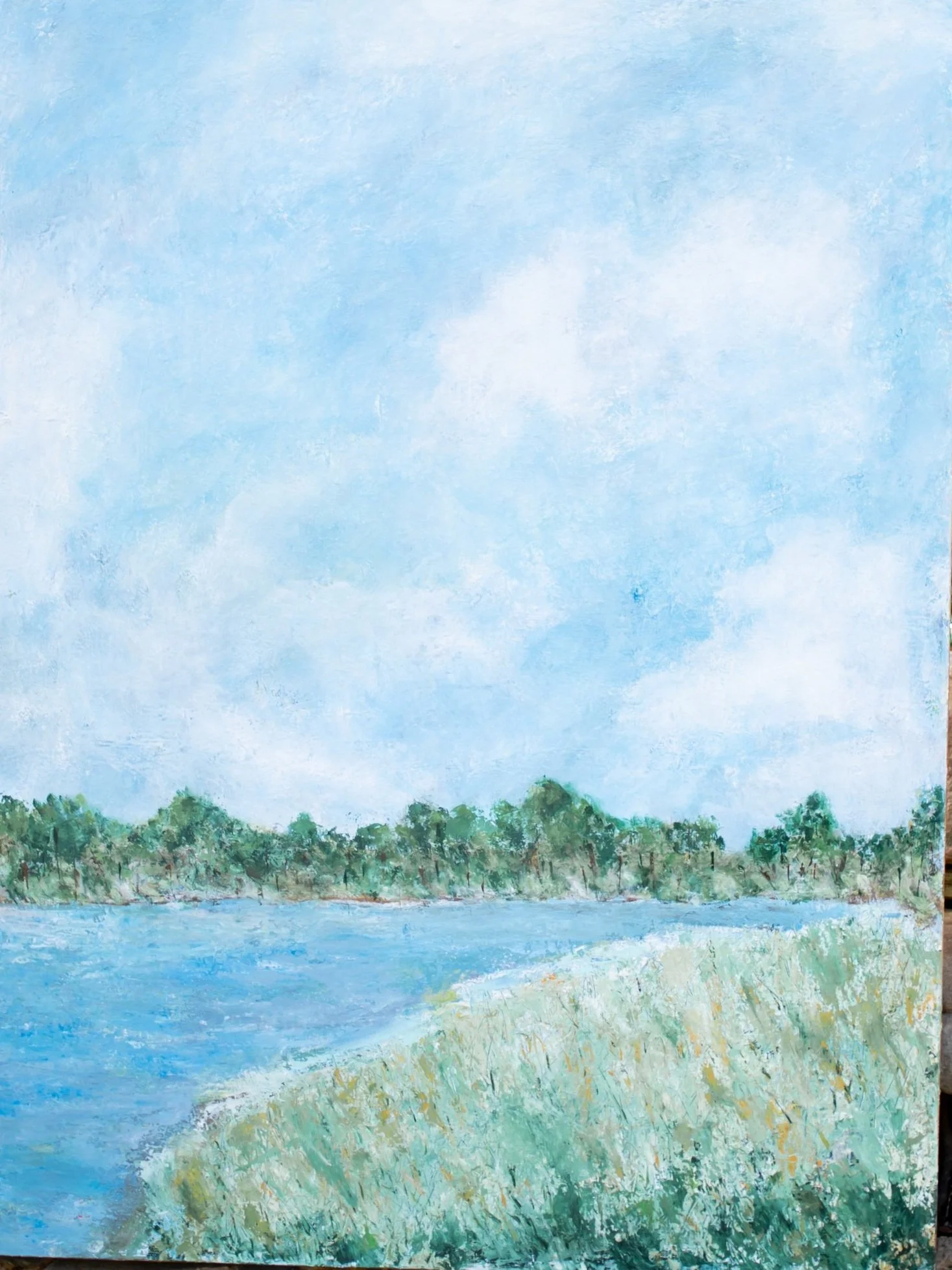 "Along the Quiet Shore" coastal landscape painting featuring calm water, soft blue tones, and marshland inspired by the South Carolina Lowcountry.