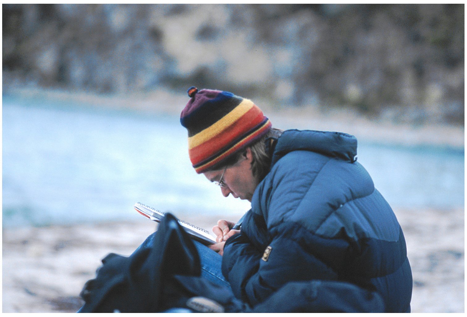 Taking notes by Lake Titicaca, Bolivia. 