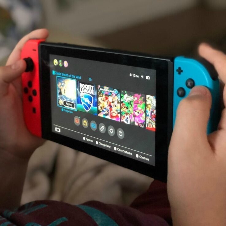 child-playing-with-nintendo-switch-console-e1575287434867.jpg