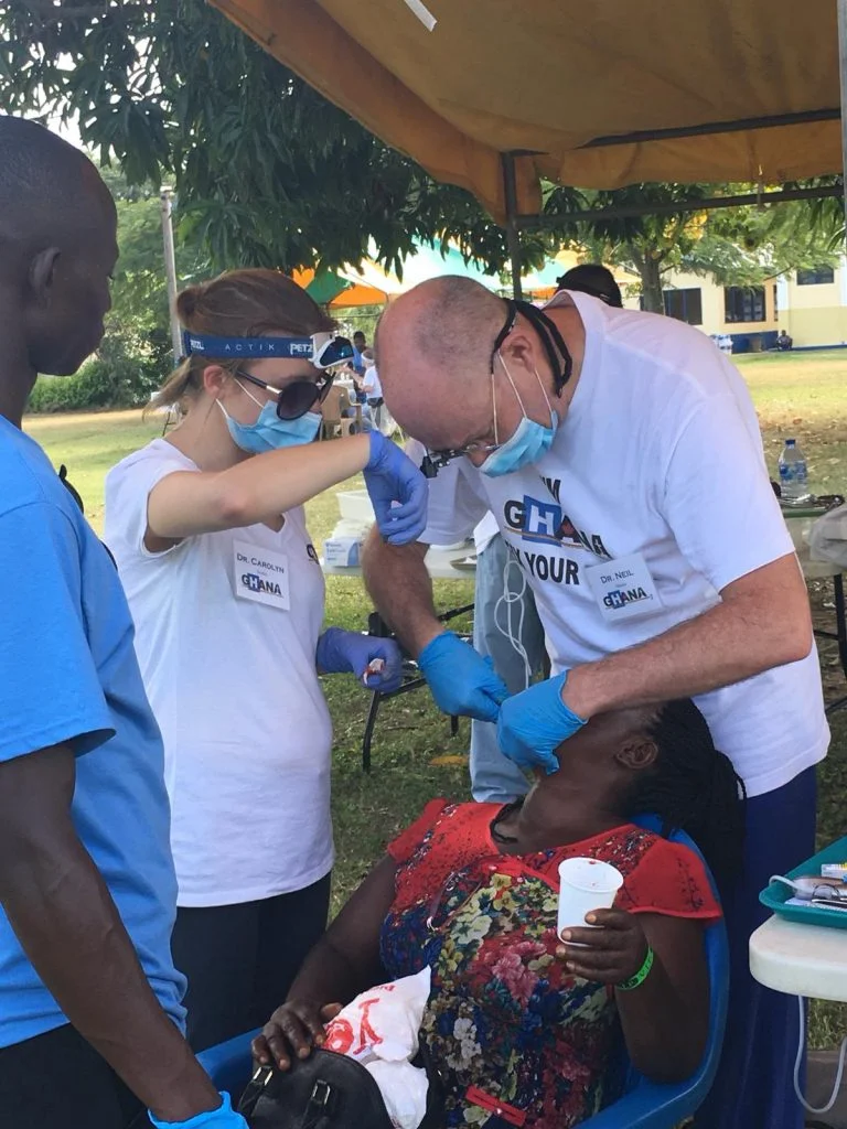 Dr. Neil and Dr. Carolyn under the dental tent.