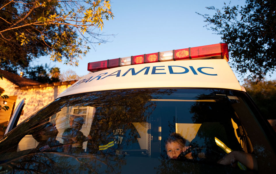 Joey Williams, a Life Line paramedic, lifts his son Owen into the ambulance as his oldest son, Cash, sits at the wheel at the Ojai Life Line paramedic station in Ojai, Calif. on Sunday, Oct. 10, 2010. It was Owen’s first birthday and wanted to see his dad.