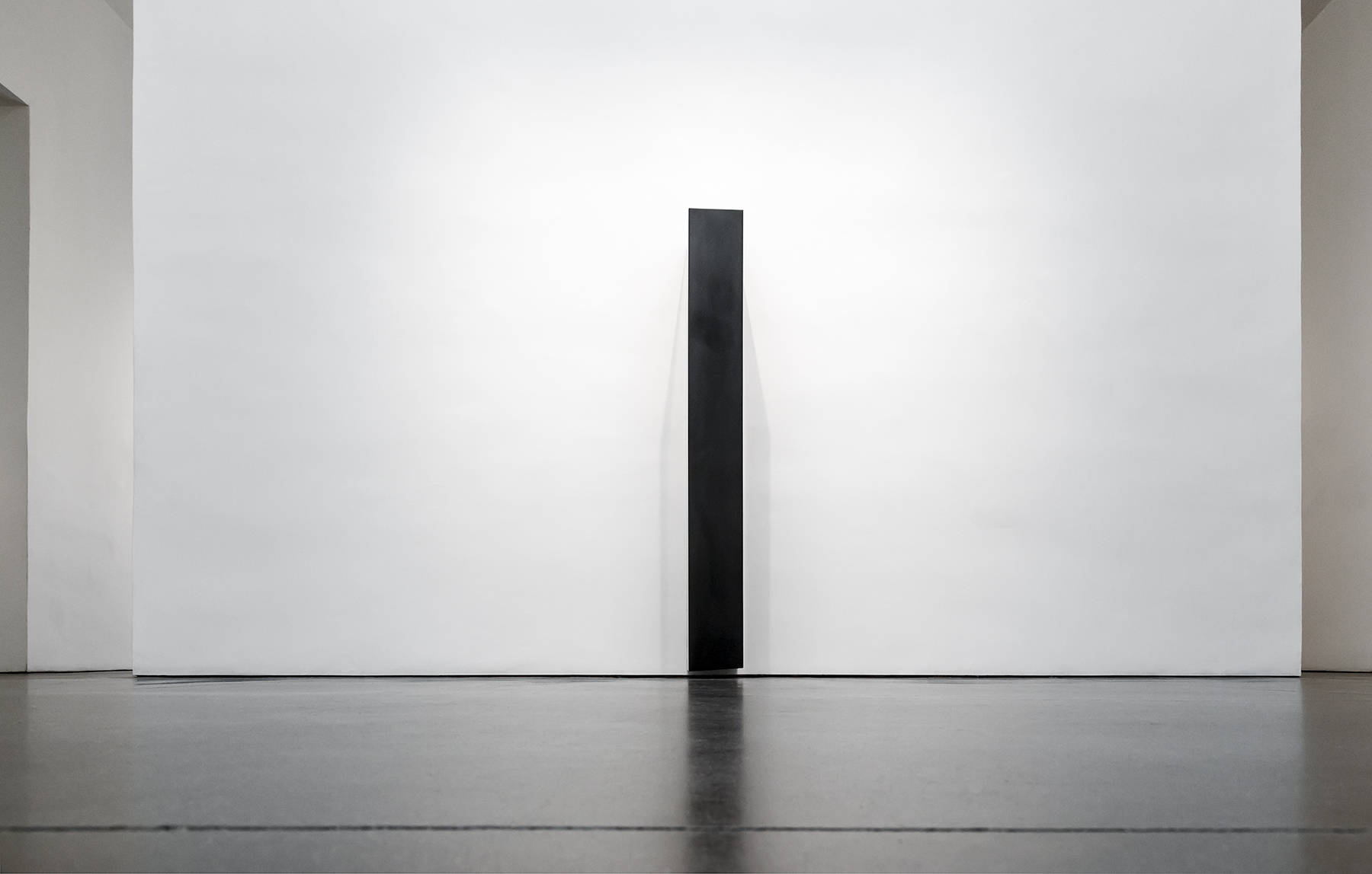   Tilted Column, 2008  Solid graphite,&nbsp;70” x 14” x 15”   Carbon: Susan York (installation view, Georgia O'Keeffe Museum, 2016) Photo: Larry Fodor 