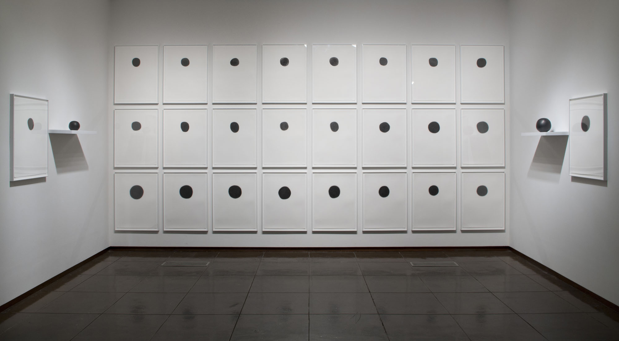   Alcoves 12.5 (installation view, New Mexico Museum of Art, 2015)   Daily Practice: Circle Drawings, Day 1-26, 2010, Graphite pencil on paper&nbsp;   Ucross Sphere no.1 and no. 26, 2010, Solid Graphite 