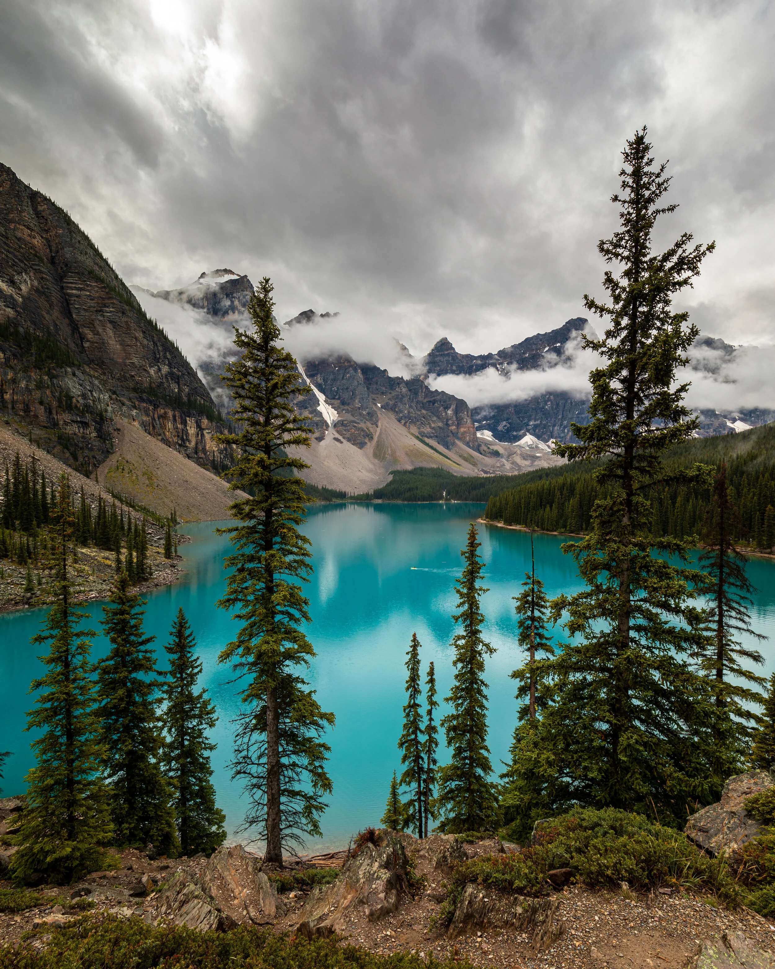 Serenity is canoeing on a mountain lake.