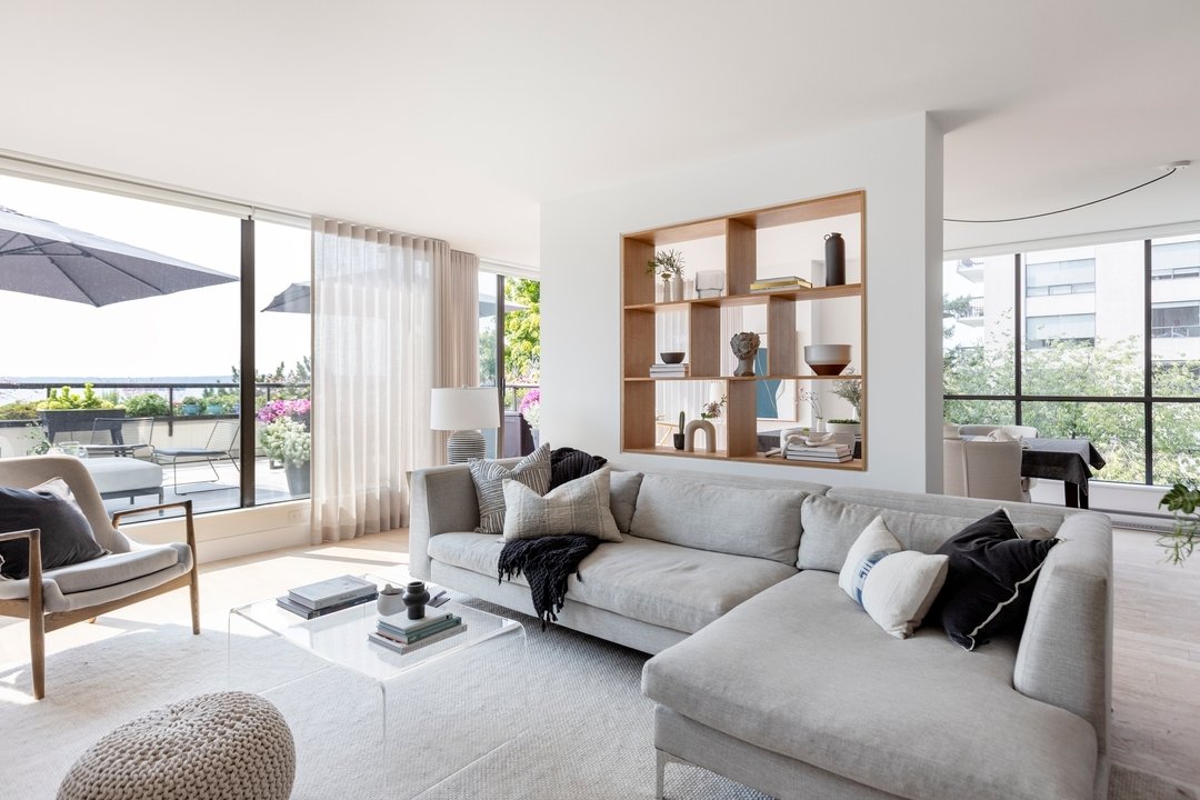 We had a large open space with a concrete support column. We decided to help define the living and dining spaces by creating this wall with custom white oak inset shelving. We love how it turned out!

Photo: @janisnicolayphotography
Design: @thehaven