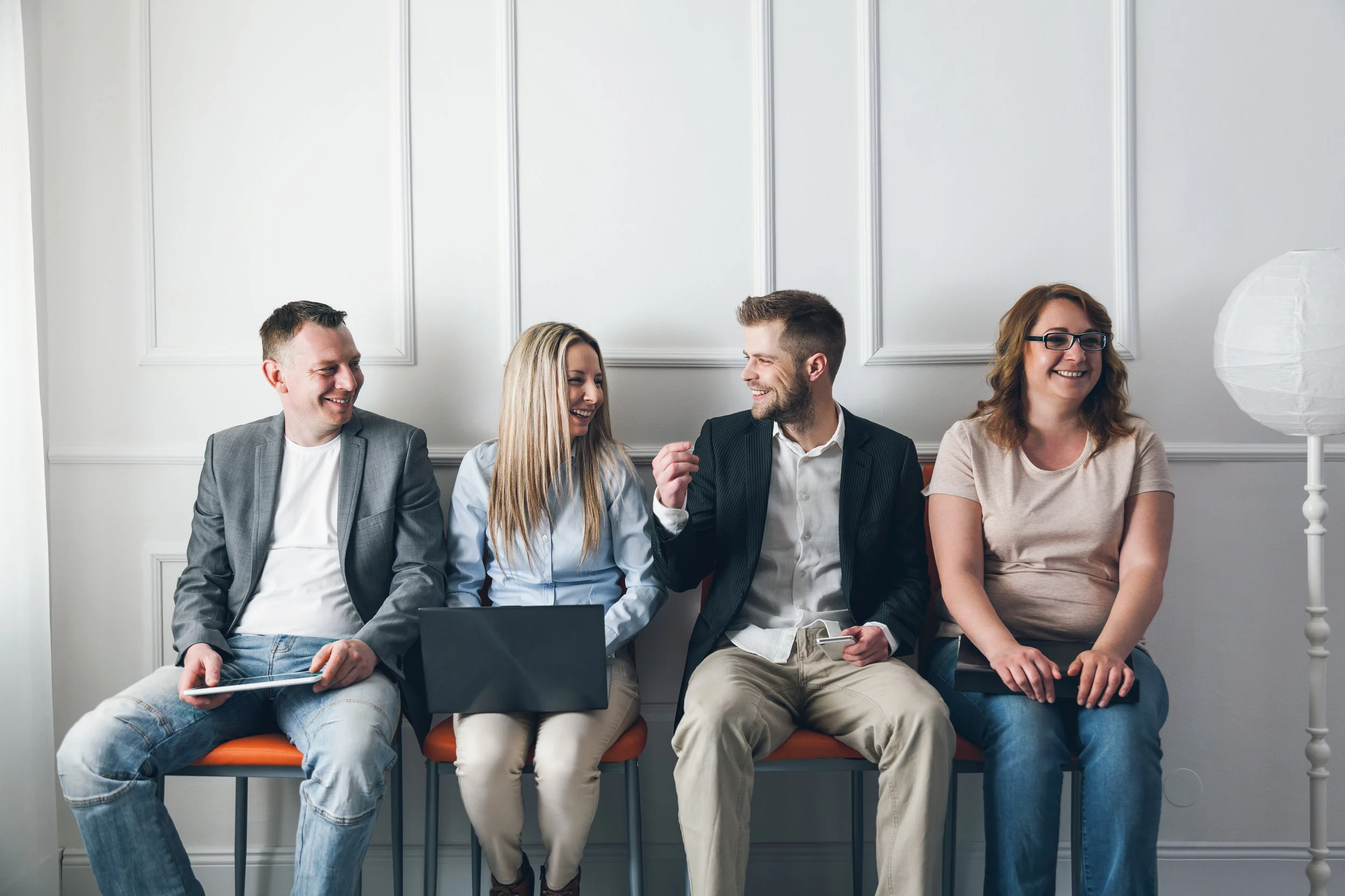 group-of-creative-people-sitting-on-chairs-in-P2MJ7VT.jpg