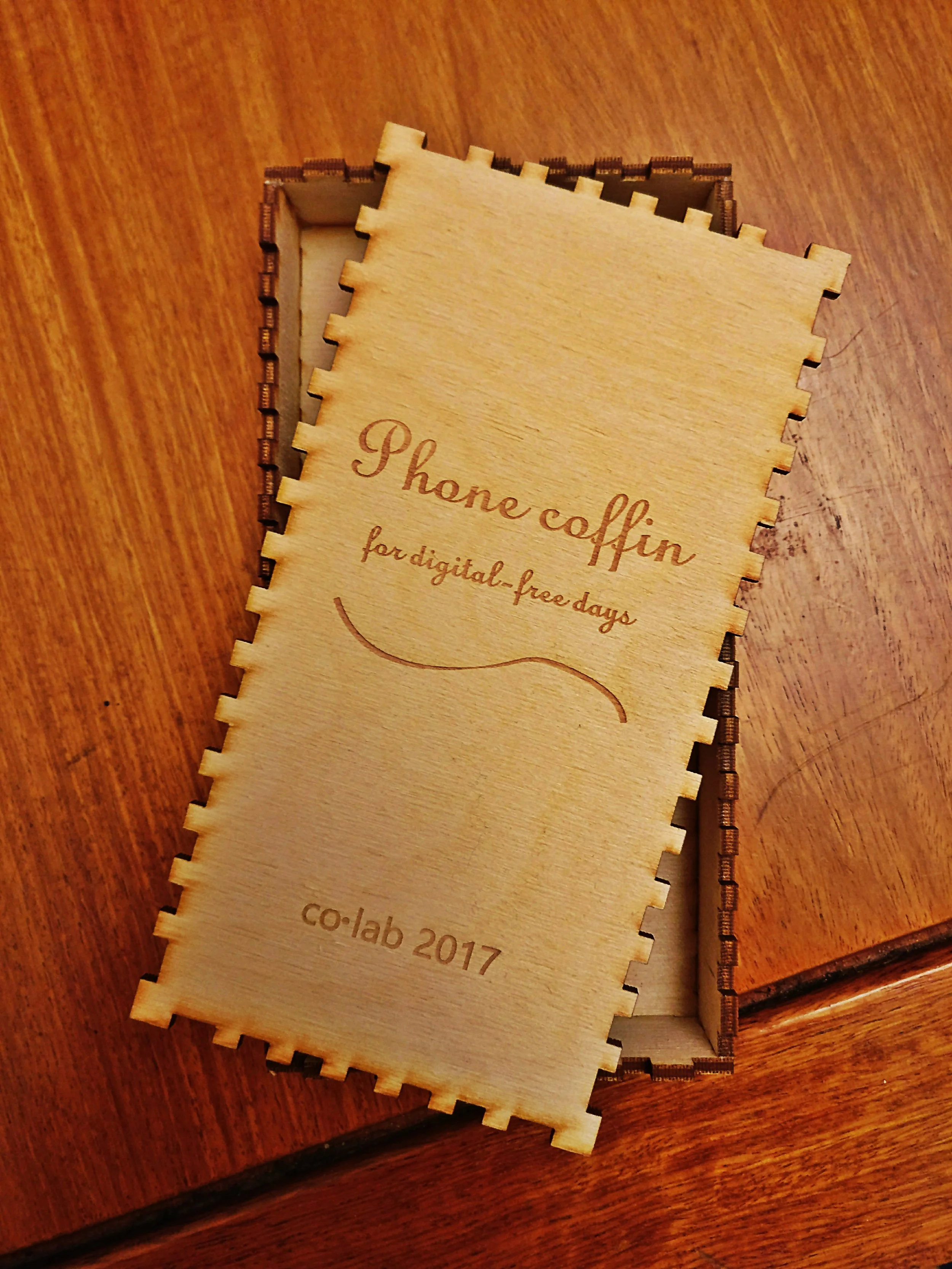 Laser-cut phone coffin made in co.lab