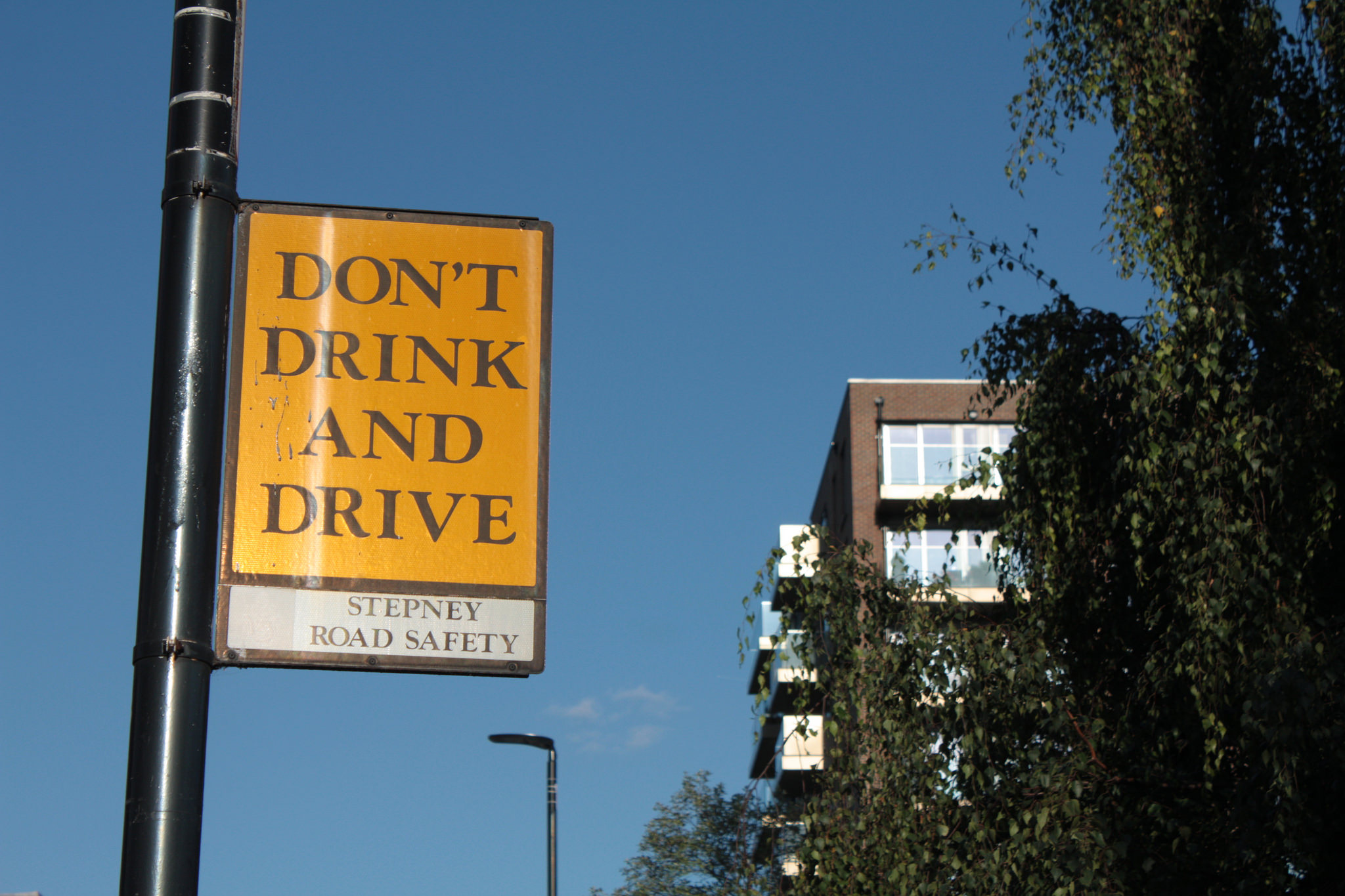 Yellow street signage stating: ‘Don’t drink and drive’