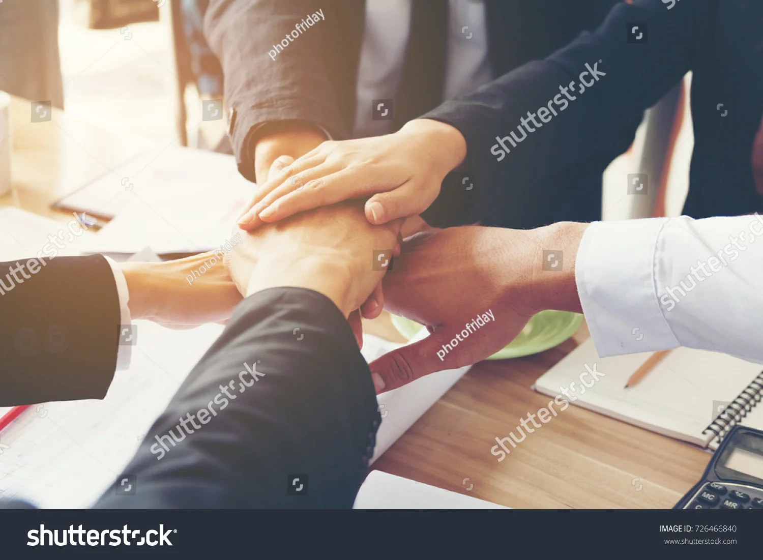about - sponsors -- stock-photo-multiethnic-hands-together-with-group-of-success-collaboration-start-up-business-people-unite-in-726466840.jpg